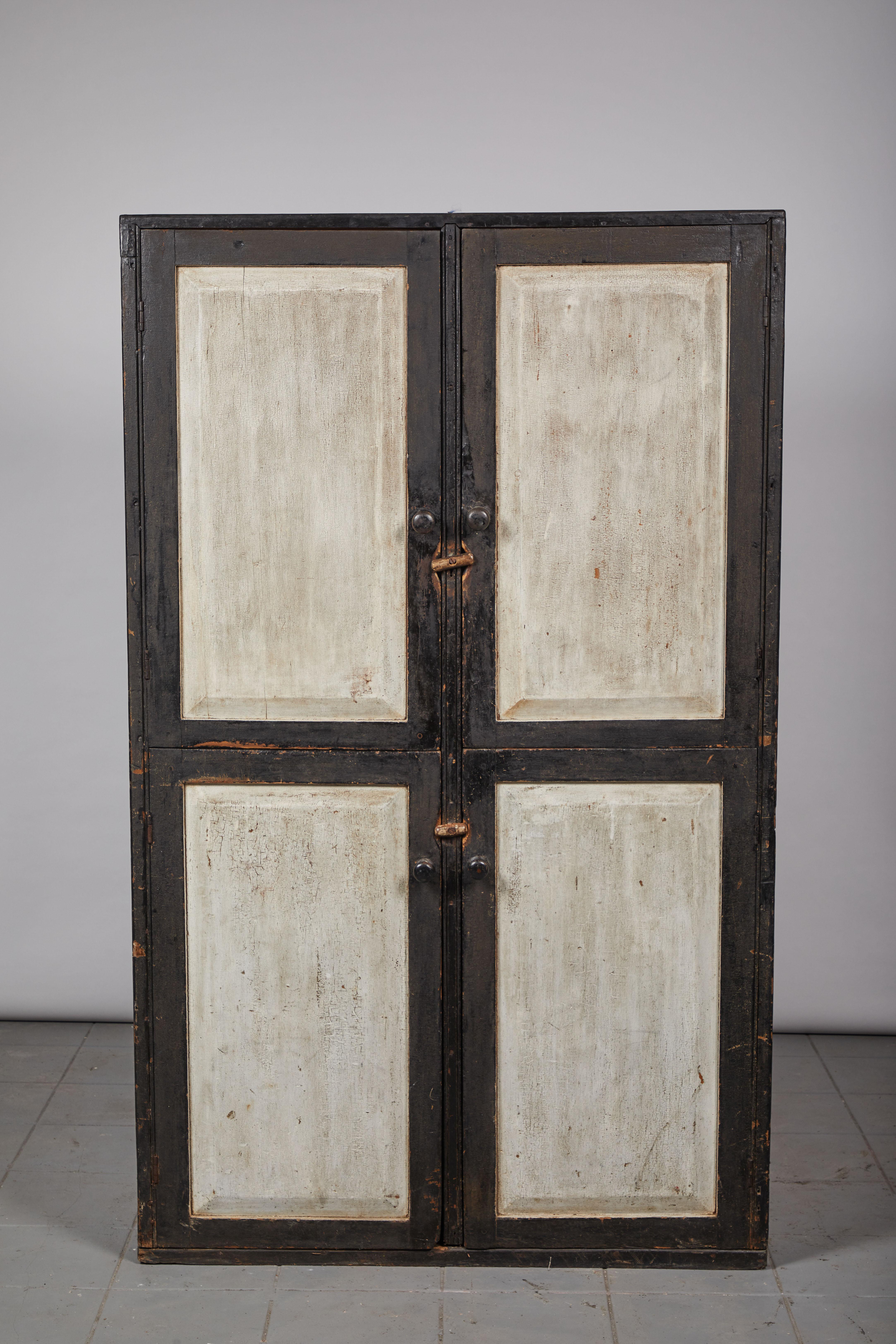Early American rustic black and white four-door cabinet hutch beautifully hand painted with toggle locks.