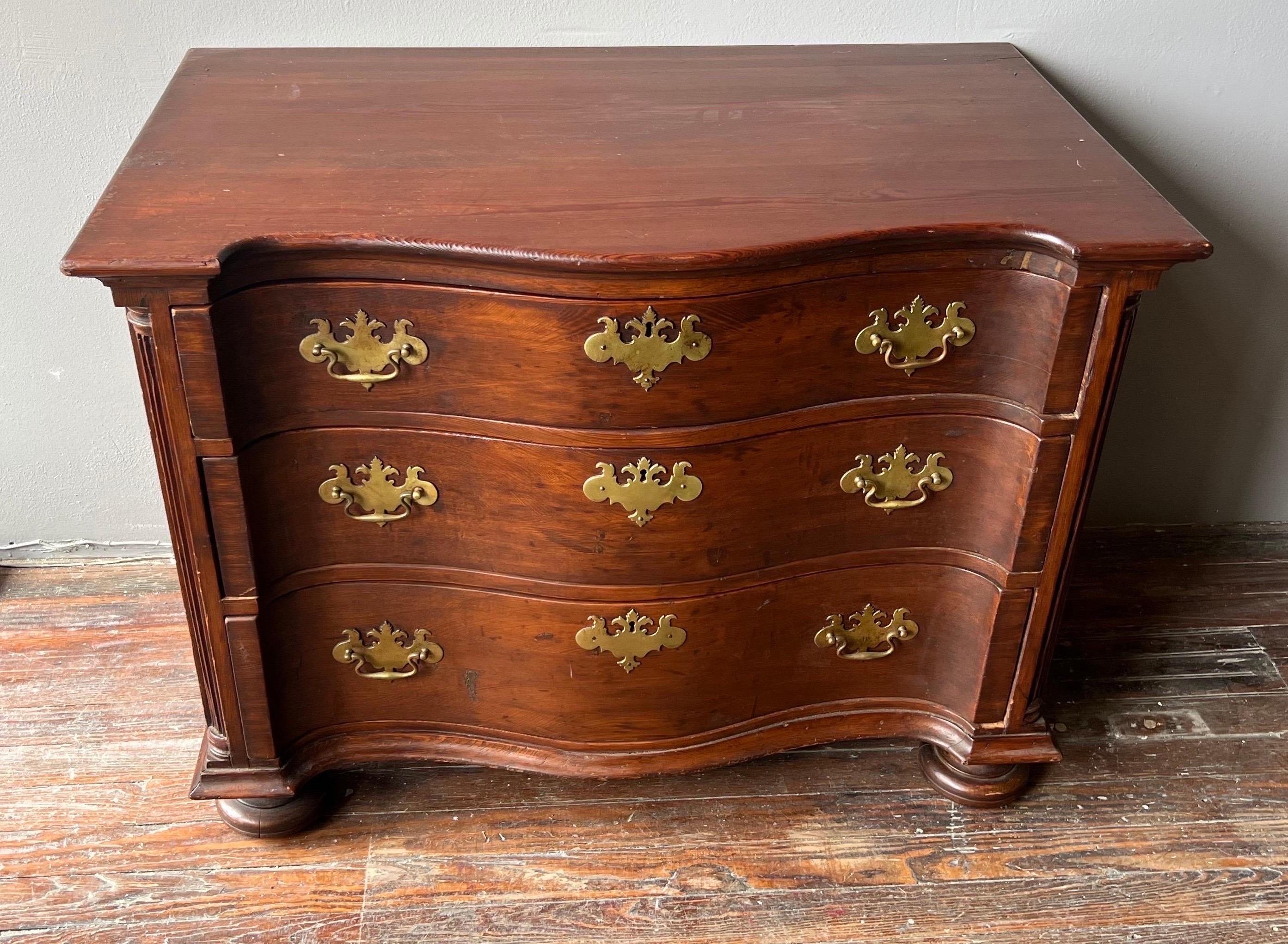 Early 18th century serpentine 3 drawer chest with quarter columns, original trunnel nails and original removable feet. Made entirely of yellow pine and poplar. Possibly made in the back country of the south. 