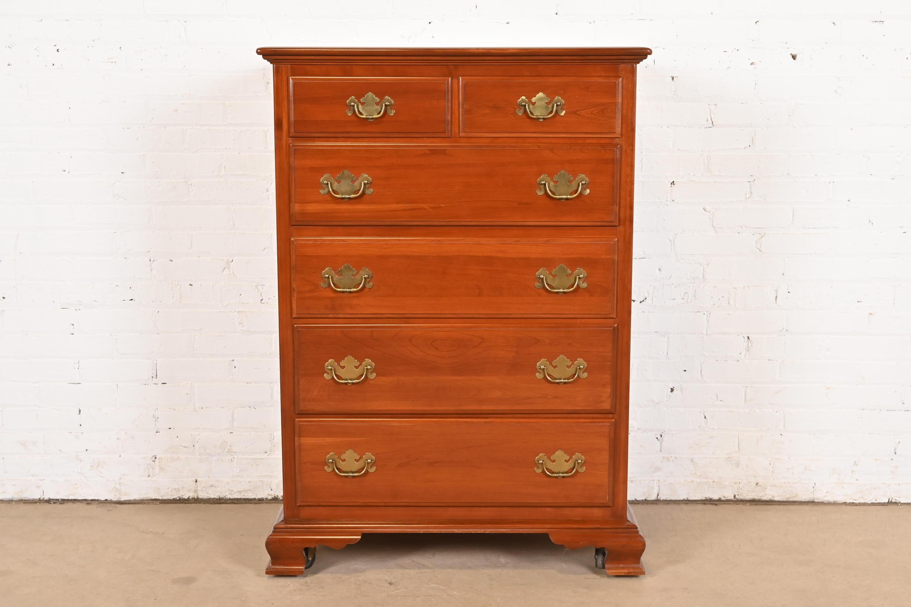 A gorgeous Early American, Georgian, or Chippendale style six-drawer highboy dresser or chest of drawers

USA, Late 20th Century

Solid cherry wood, with original brass hardware.

Measures: 34.75