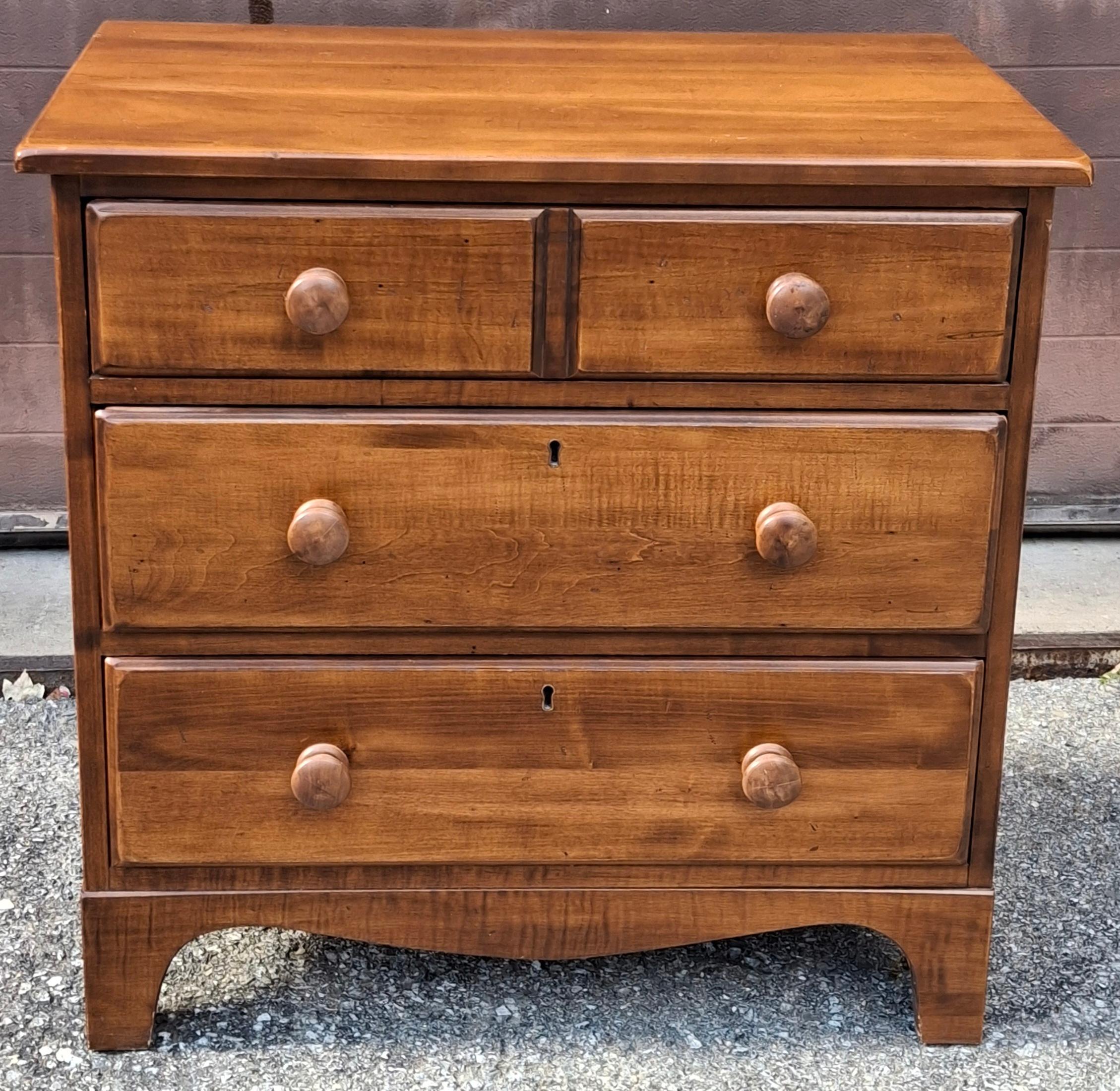 An Early American Style Cherry Three-Drawer Commode Bedside Chest of Drawers. Dovetail joints drawer flawlessly opening and closing.
Measures: 28