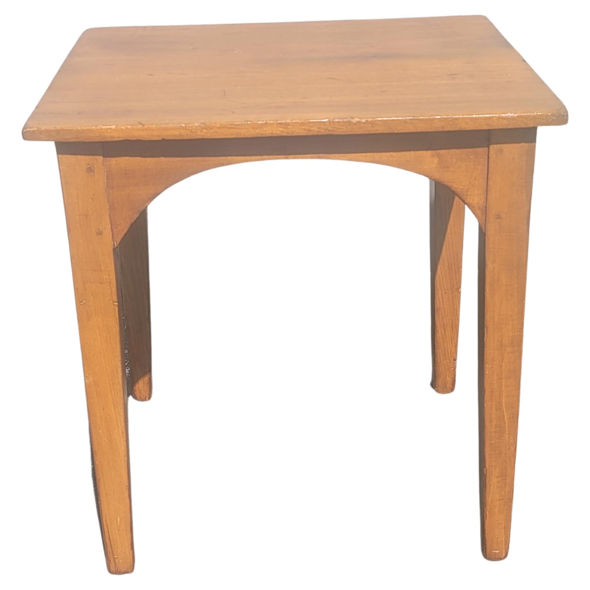 An early American handcrafted maple side table measuring 20
