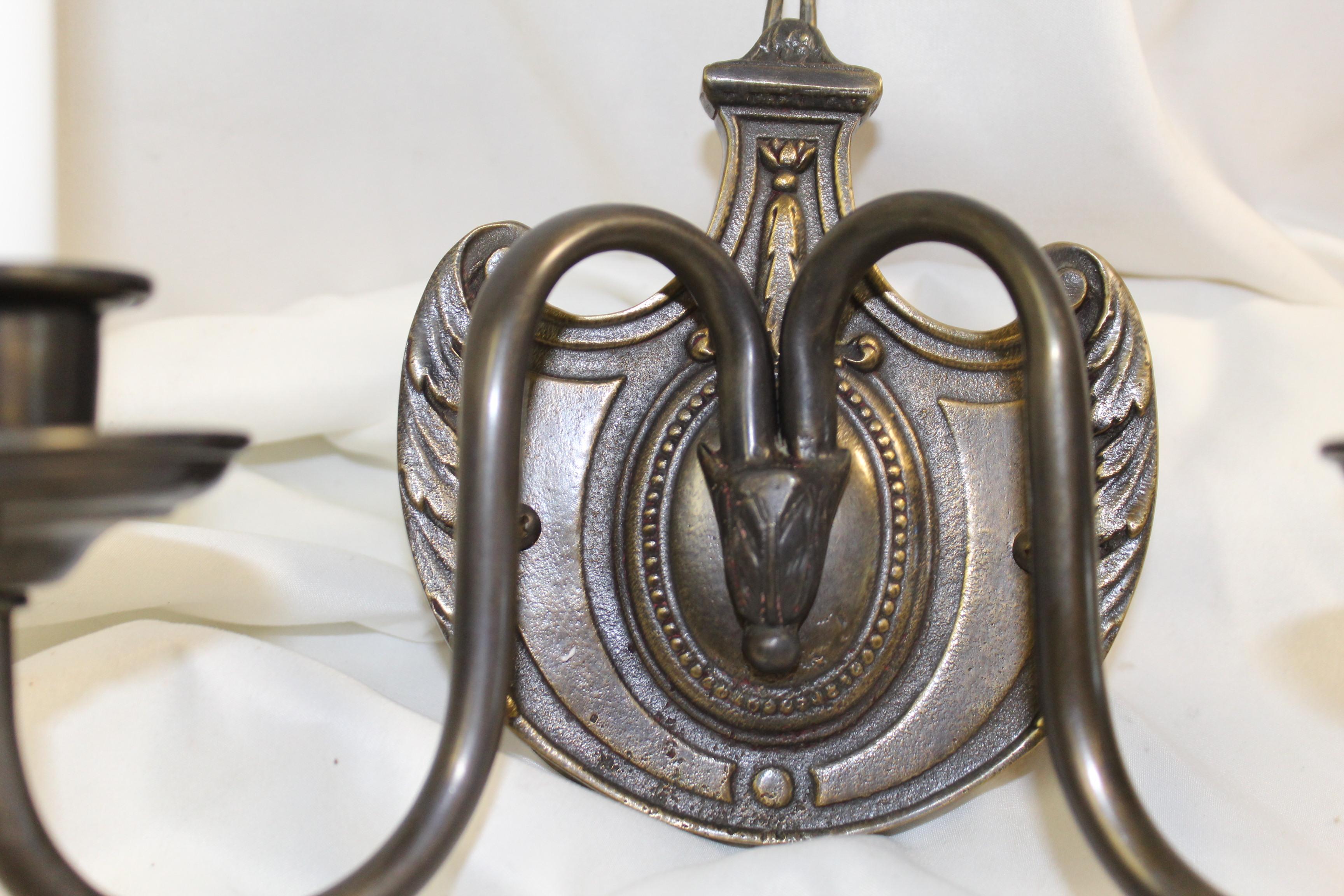 A great design of American or possibly English Sconces . All quality work and finished in a dark patina finish . Two arms with candelabra sockets and 3