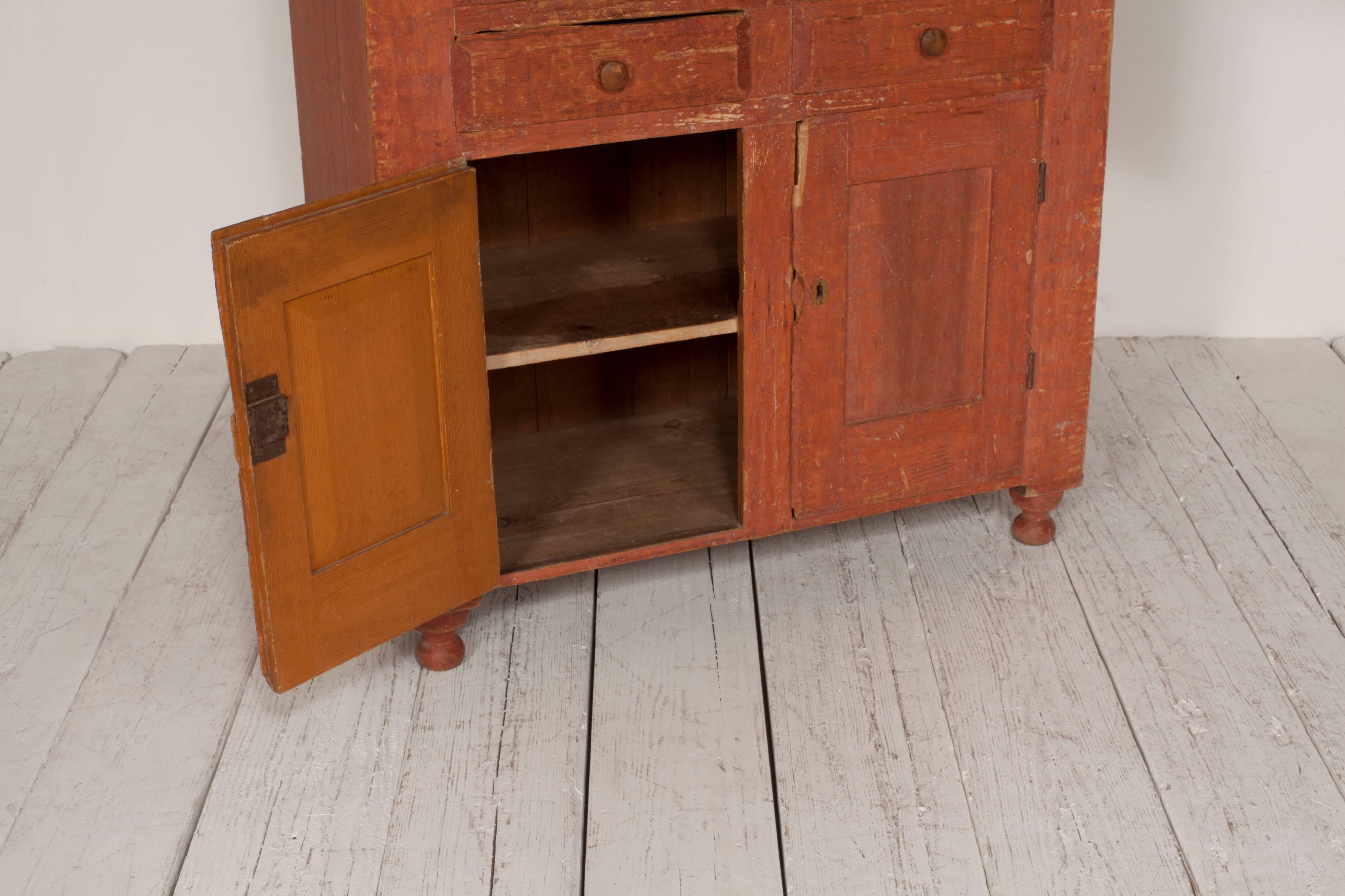 Early American Terra Cotta Stained Cabinet with Four Doors and Two Drawers 7