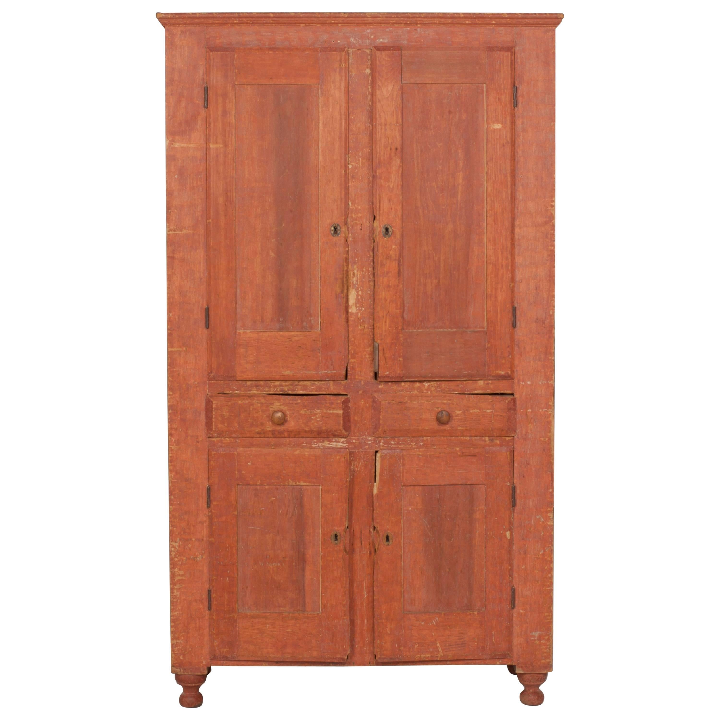 Early American Terra Cotta Stained Cabinet with Four Doors and Two Drawers