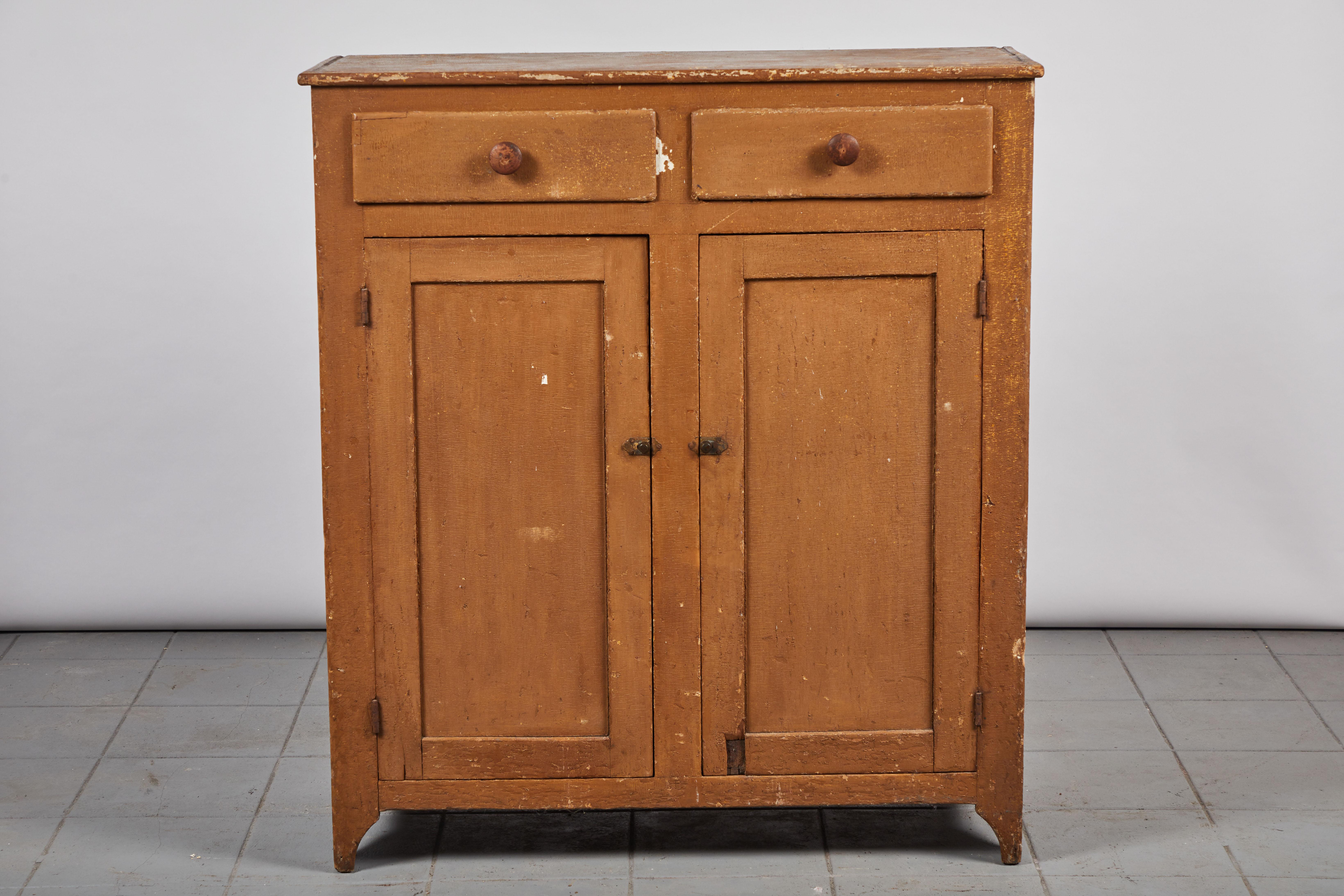 Early american two-door and two-drawer painted server with original painted details.