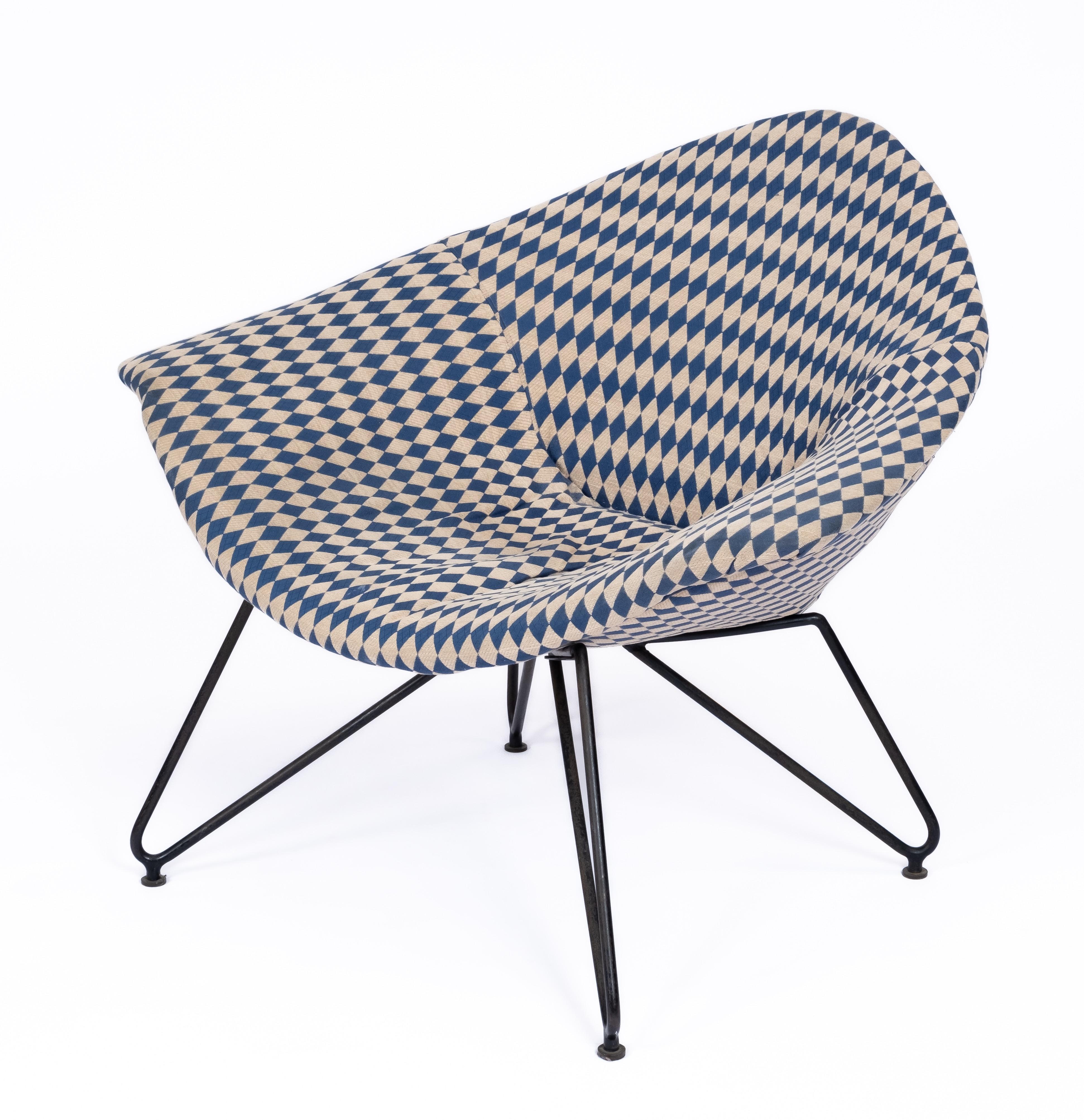 An early and original lounge chair on rare black hairpin legs, upholstered with a white and blue checkered pattern. Labeled on underneath with the original and early 'fratelli Saporiti/ besnate (italia) / modello/brevbettato' lable and 'Made in