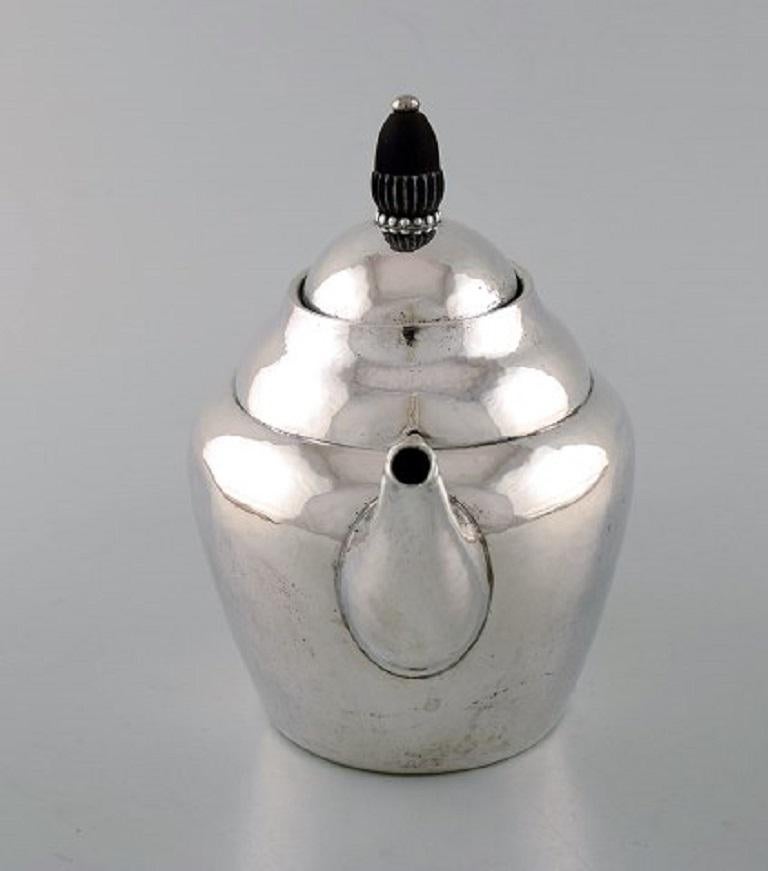 Early and Rare Jensen Teapot in Hammered Silver with Handle in
