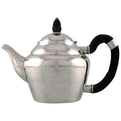 Early and Rare Georg Jensen Teapot in Hammered Silver with Handle in Ebony