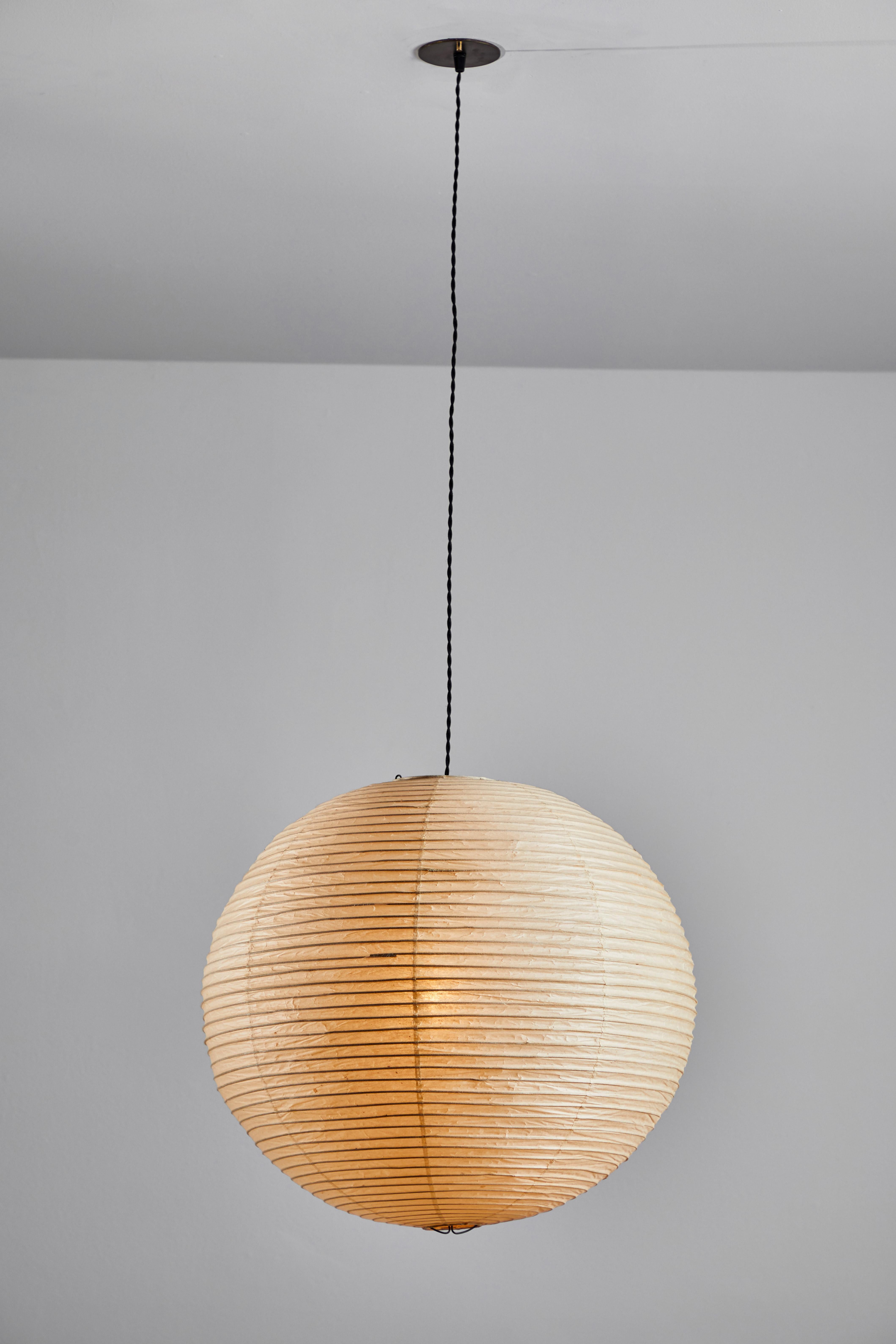 Early and Rare Model 19A Light Sculpture by Isamu Noguchi for Akari. Manufactured in Japan, 1951. Rice paper, bamboo, steel wire. Early sun/moon stamp. Model 19A , easily identified by the suffix ‘A’. was the the first sphere shaped light in the