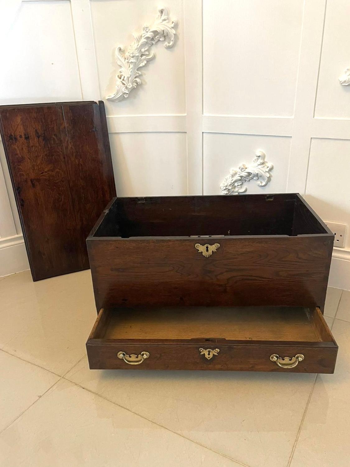 Early Antique 18th century small Welsh oak coffer having a quality oak removable lid with a moulded edge revealing a storage compartment, one long drawer, quality brass handles and escutcheons standing on bracket feet. 

A very desirable example