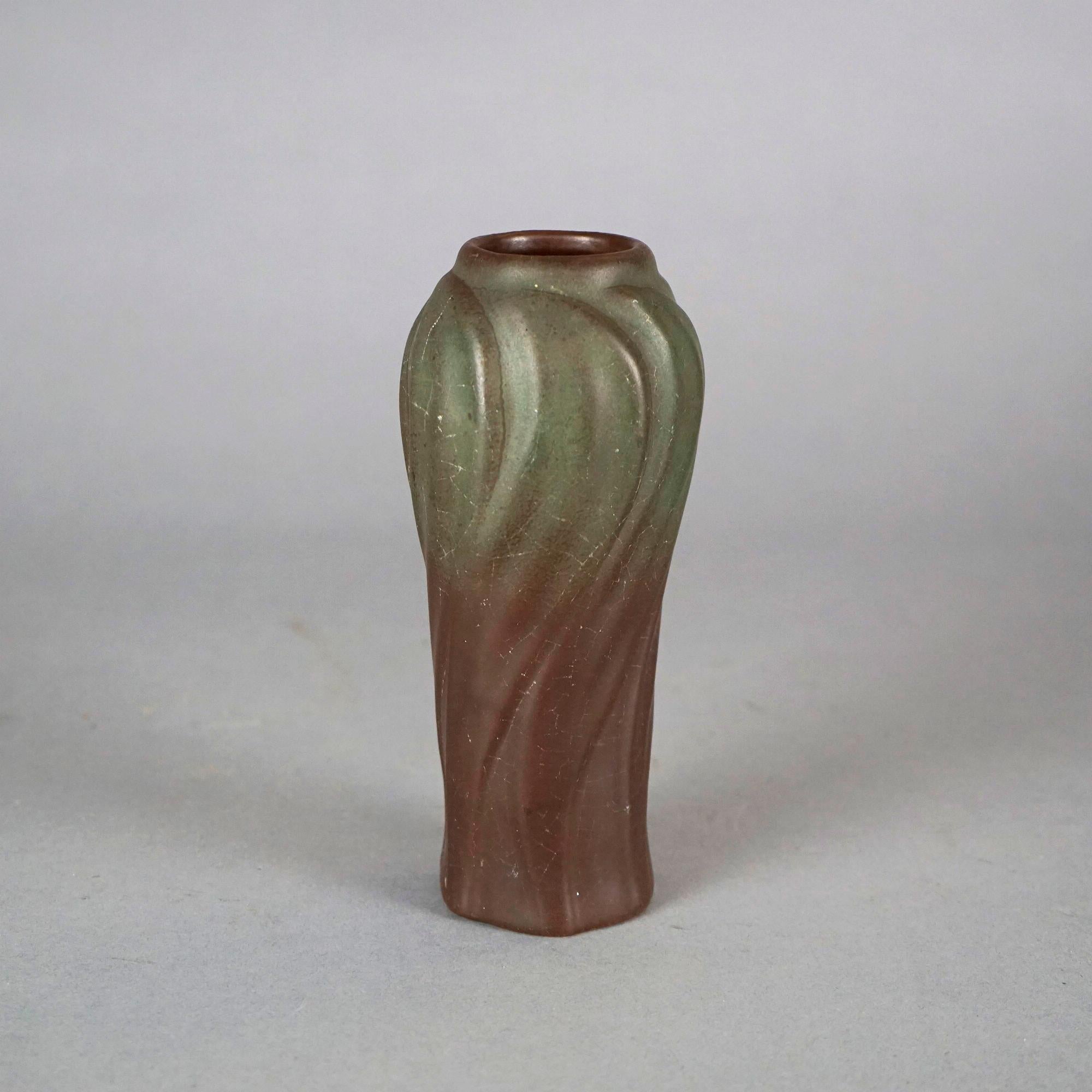 An early antique Arts and Crafts vase by Van Briggle offers art pottery construction in swirl form, maker signed as photographed, c1910

Measures- 7.25''H x 3.25''W x 3.25''D.

Catalogue Note: Ask about DISCOUNTED DELIVERY RATES available to most