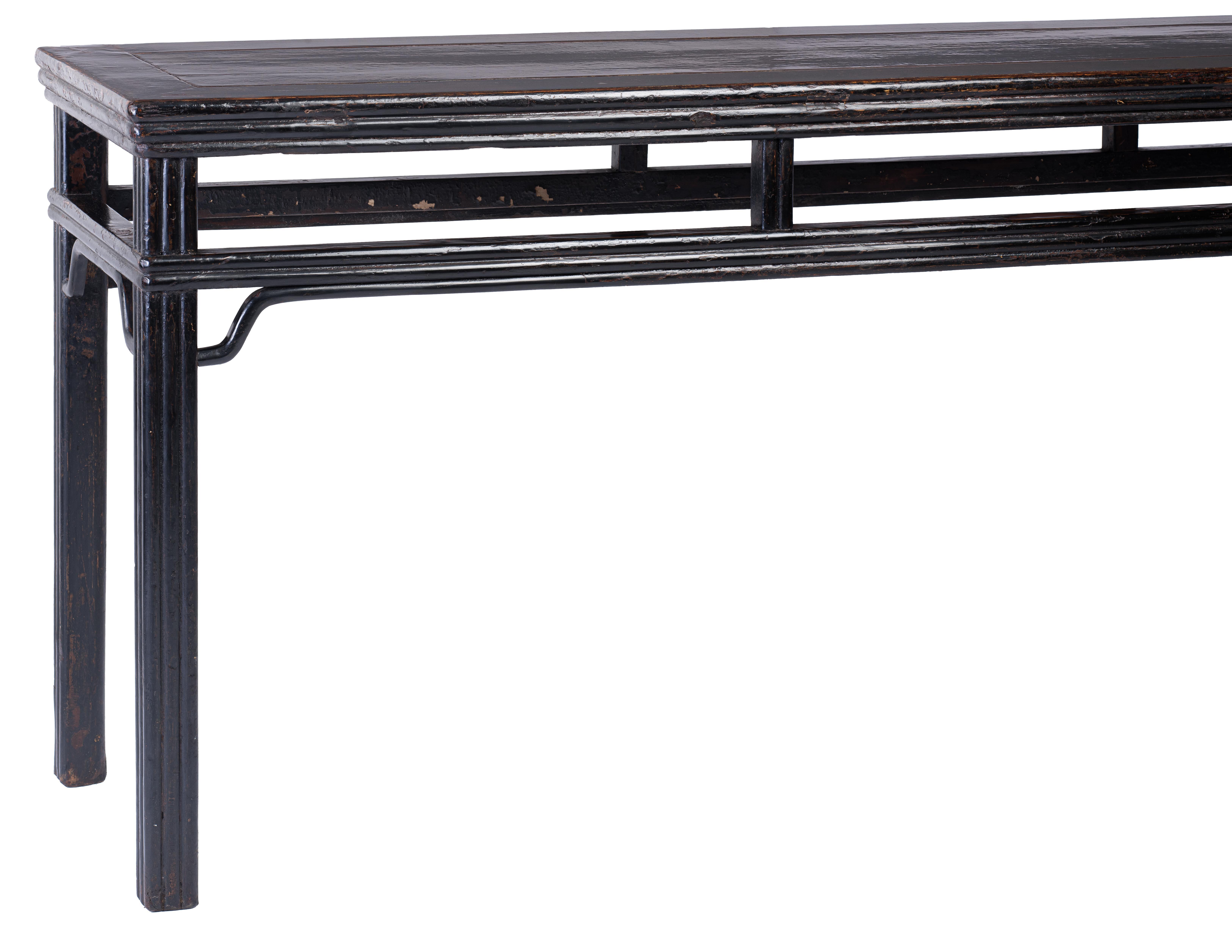 Fine Table

The table with carved lipped molding, topped with a floating panel within a frame, supported on corner legs with wrapped-around humpback stretchers, attached wrapped-around humpback spandrels and vertical struts

Black Lacquer over