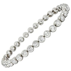 Early Art Deco 11.50 Carat Platinum Round Bezel Line Bracelet, circa 1920