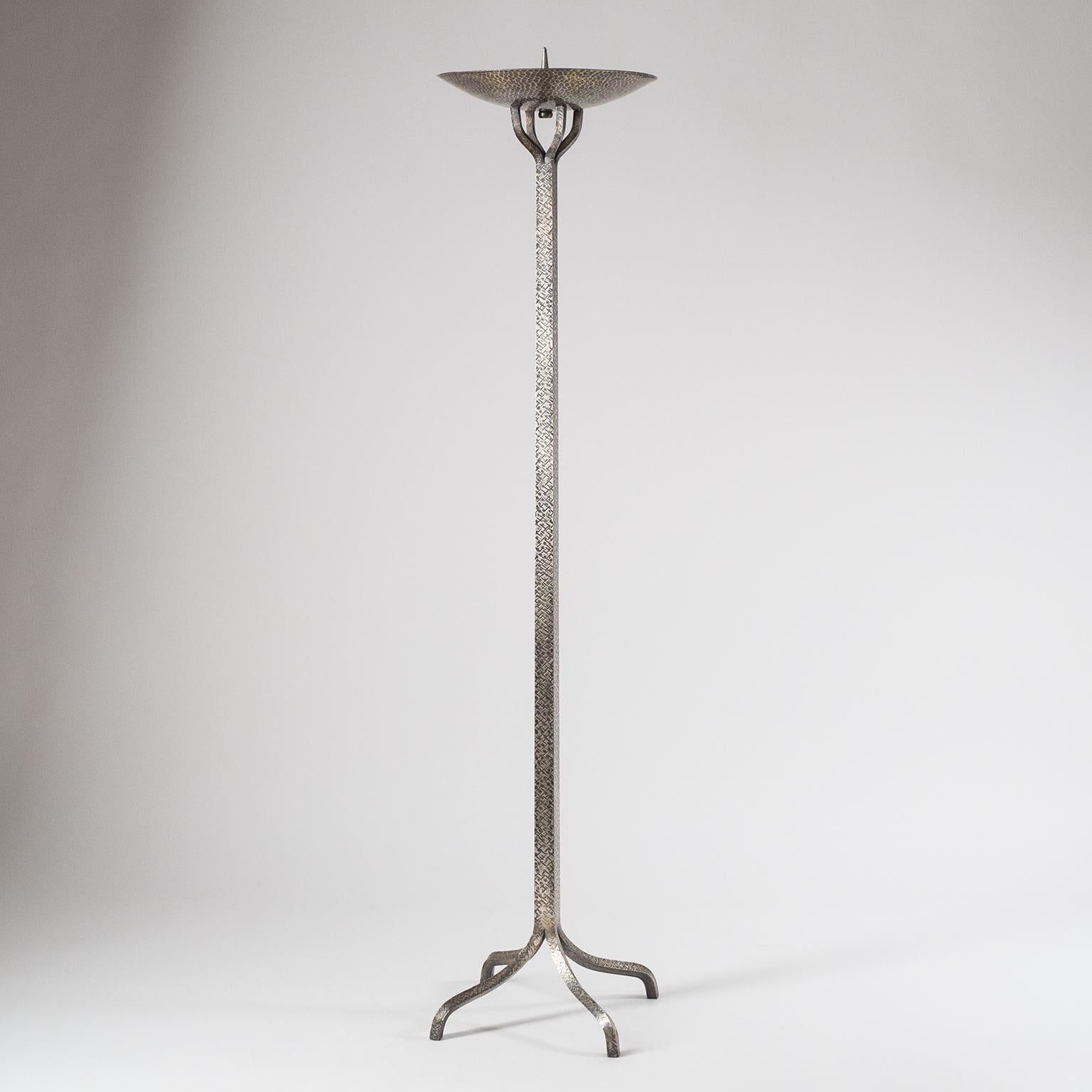 Rare Art Deco altar candlestick from Austria, early 20th century. Beautiful design and craftsmanship with the entire Stand worked from a single piece of solid brass, wrought and hammered with a silver finish. The large candle bowl has a diameter of