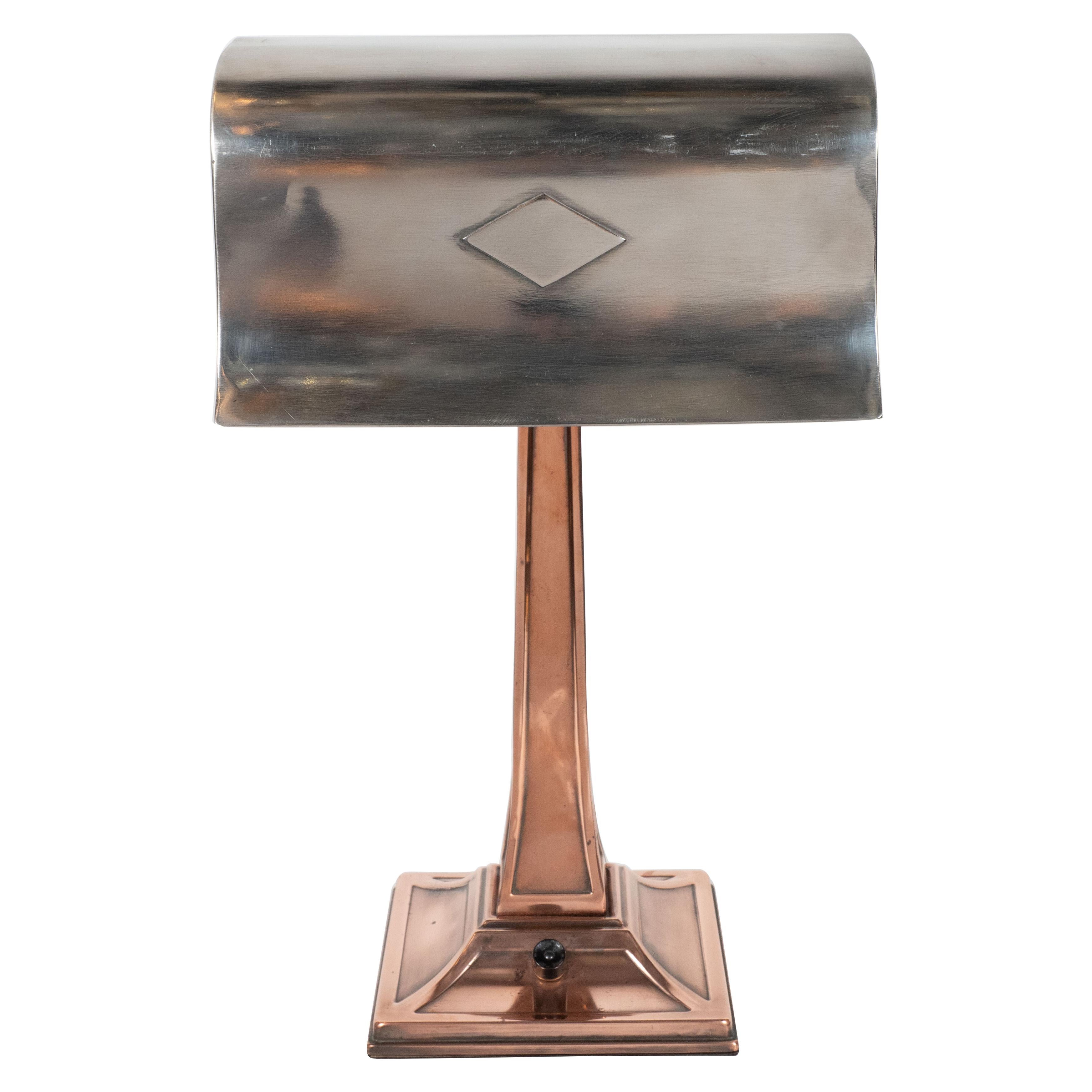 This elegant Art Deco table lamp was realized in the United States, circa 1930. It features a pagoda style base with channel detailing at each perimeter edge, from which a tapered body ascends- all in lustrous hand forged copper. The polished