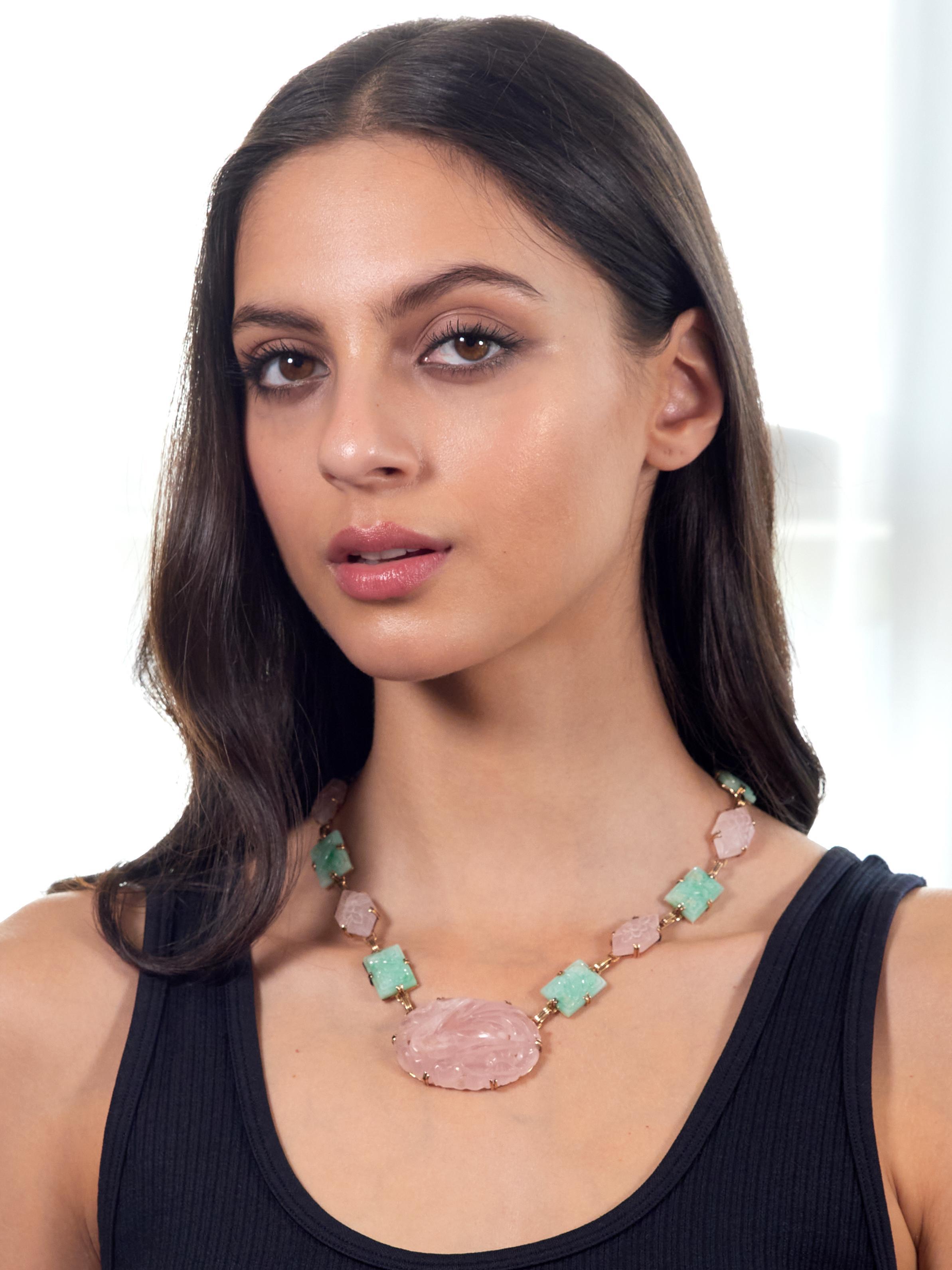 Comprised of carved jade and rose quartz stations set with split prongs
Jade is rectangular shaped and measures 12.5 x 18.0 mm each
Translucent light pastel green with white to medium swirling
Carved to depict birds perched among flowers and