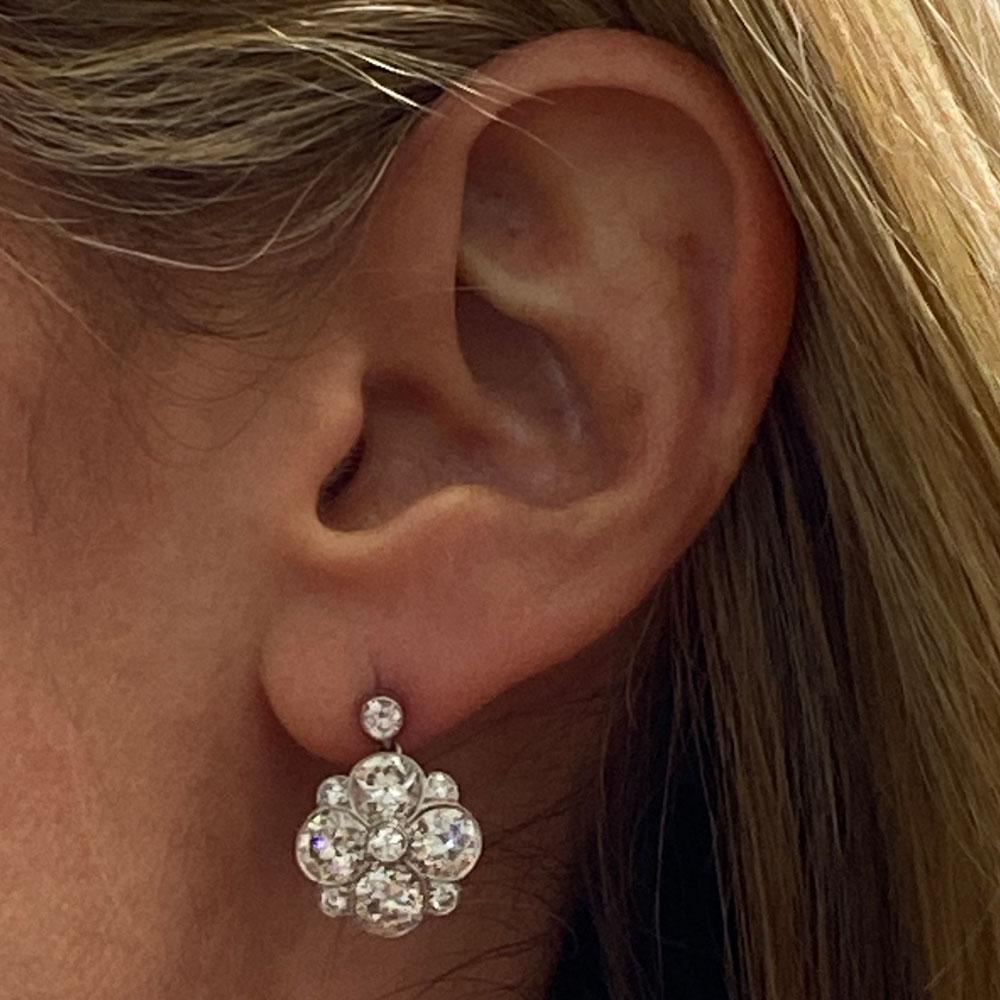 Gorgeous Early Deco Diamond Drop Earrings. Hand crafted in platinum, the earrings feature Old European Cut Diamonds. There are eight .50 carat OEC diamonds totaling 4.00 CTW, plus another .70 carat total weight of side diamonds. The Old European Cut