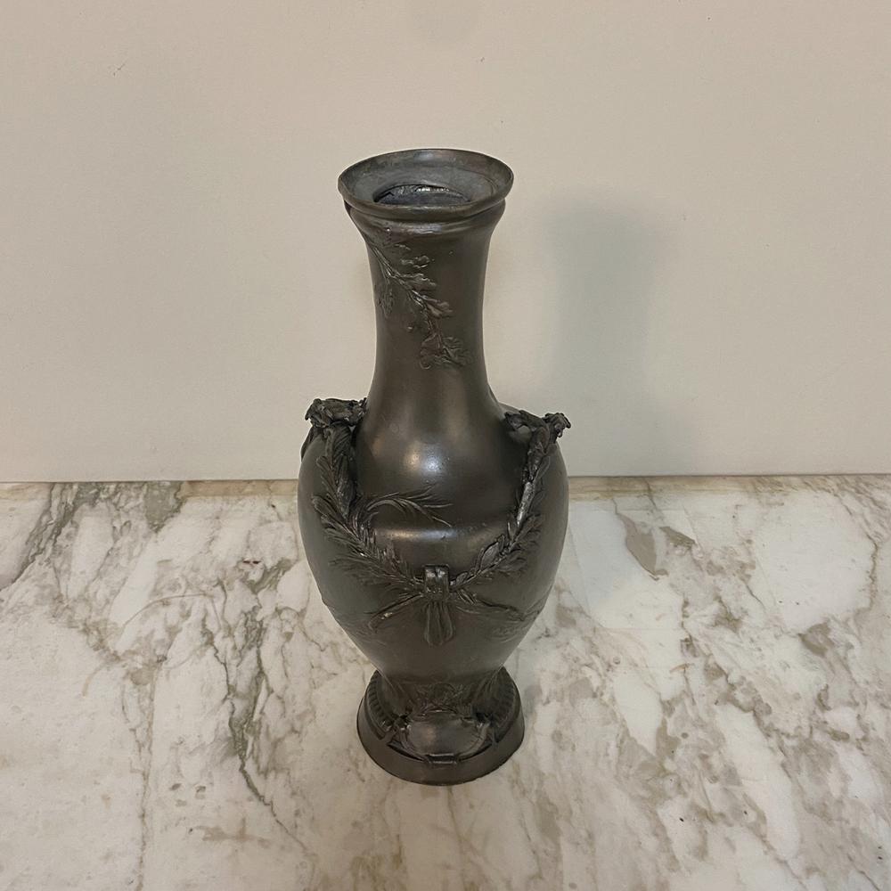 Early Art Deco period pewter vase displays the form of the Art Nouveau period, but with more classic and what was considered 