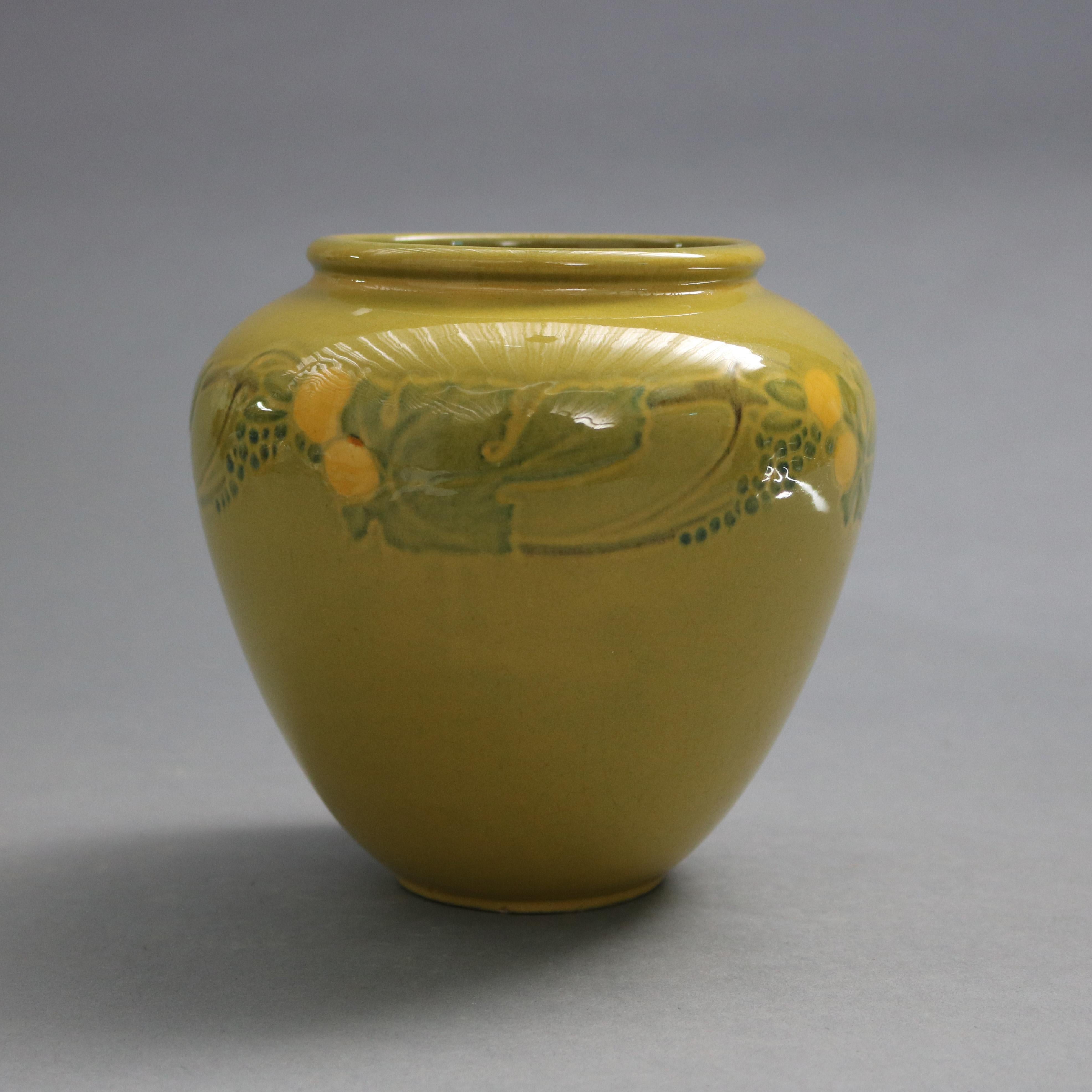 An antique and early Arts & Crafts vase by Roseville offers art pottery construction with floral and foliate band in a rare experimental glaze, signed and numbered on base as photographed, 1920-1930

Measures: 6.25