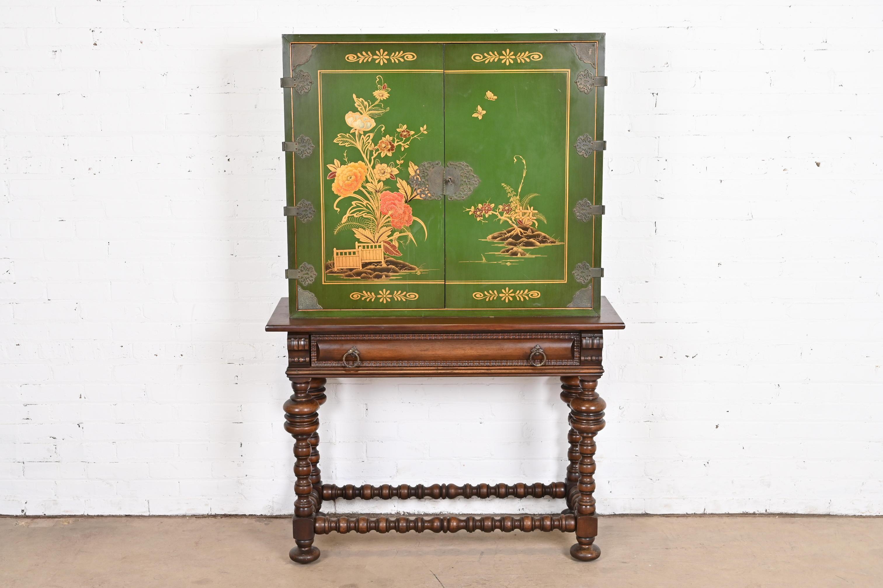 A gorgeous Chinoiserie Jacobean style bookcase, dining cabinet, or bar cabinet

By Baker Furniture

USA, Circa 1920s

Carved walnut, green lacquered case with hand painted Chinoiserie scenes, and original brass hardware. Cabinet locks, and key is