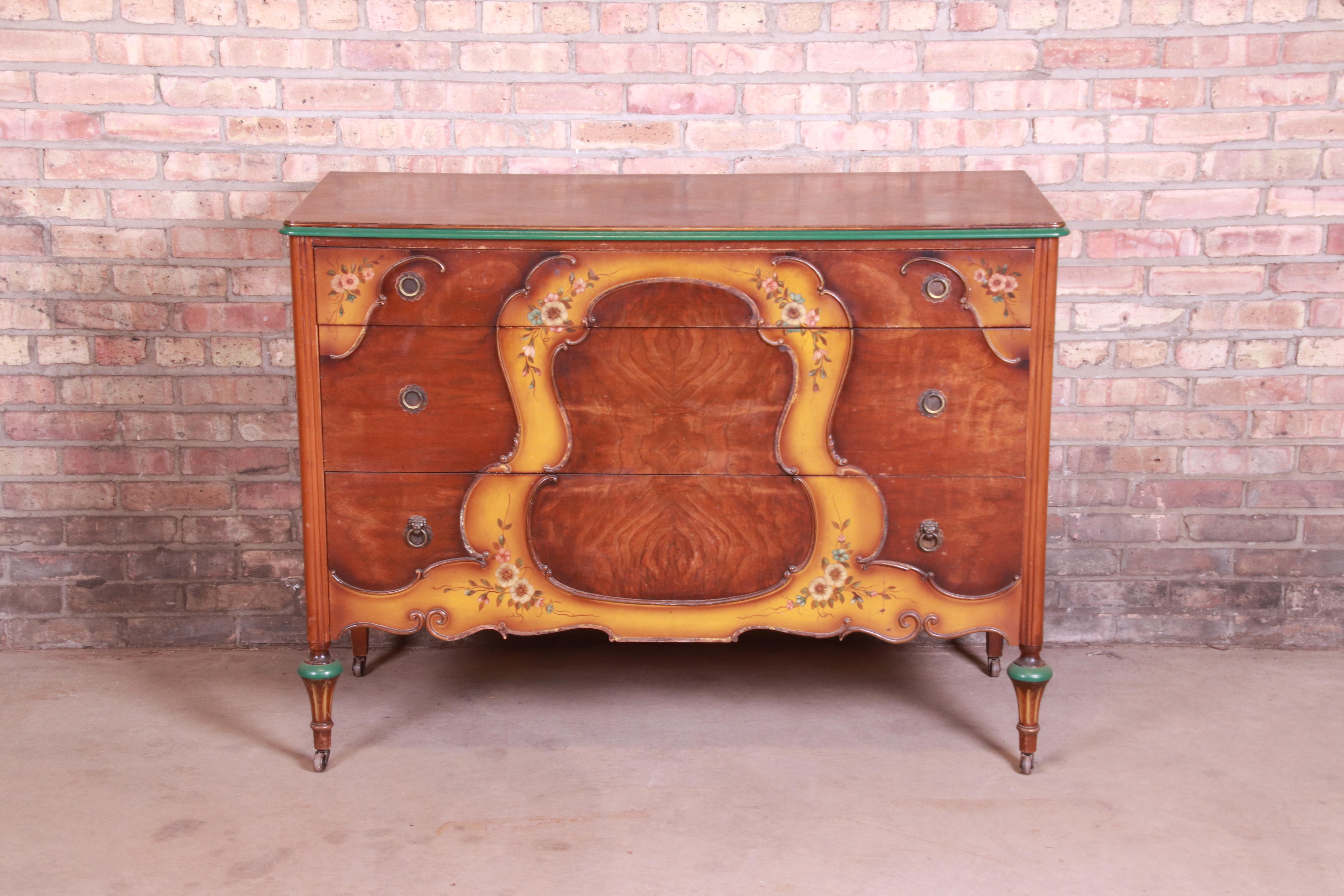 A gorgeous antique French Regency Louis XVI style dresser chest

By Baker Furniture

USA, circa 1920s

Burled walnut, with hand painted floral details and brass hardware.

Measures: 50