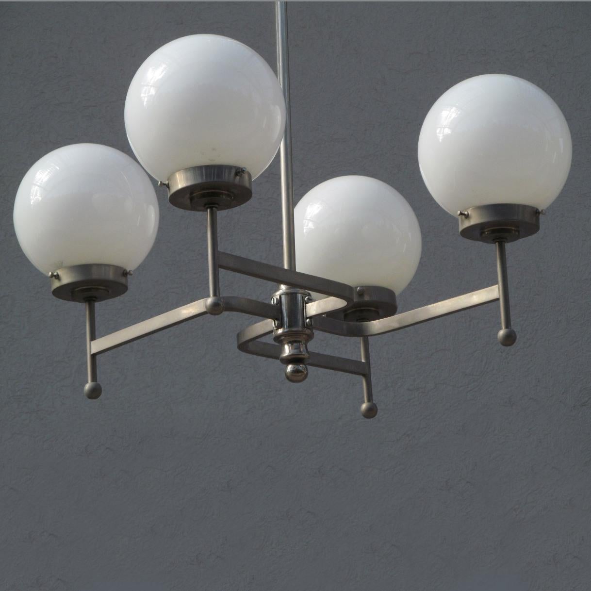 Brass Early Bauhaus Four Opaline Sphere Lights Manji Shaped Chandelier, Germany, 1920s For Sale
