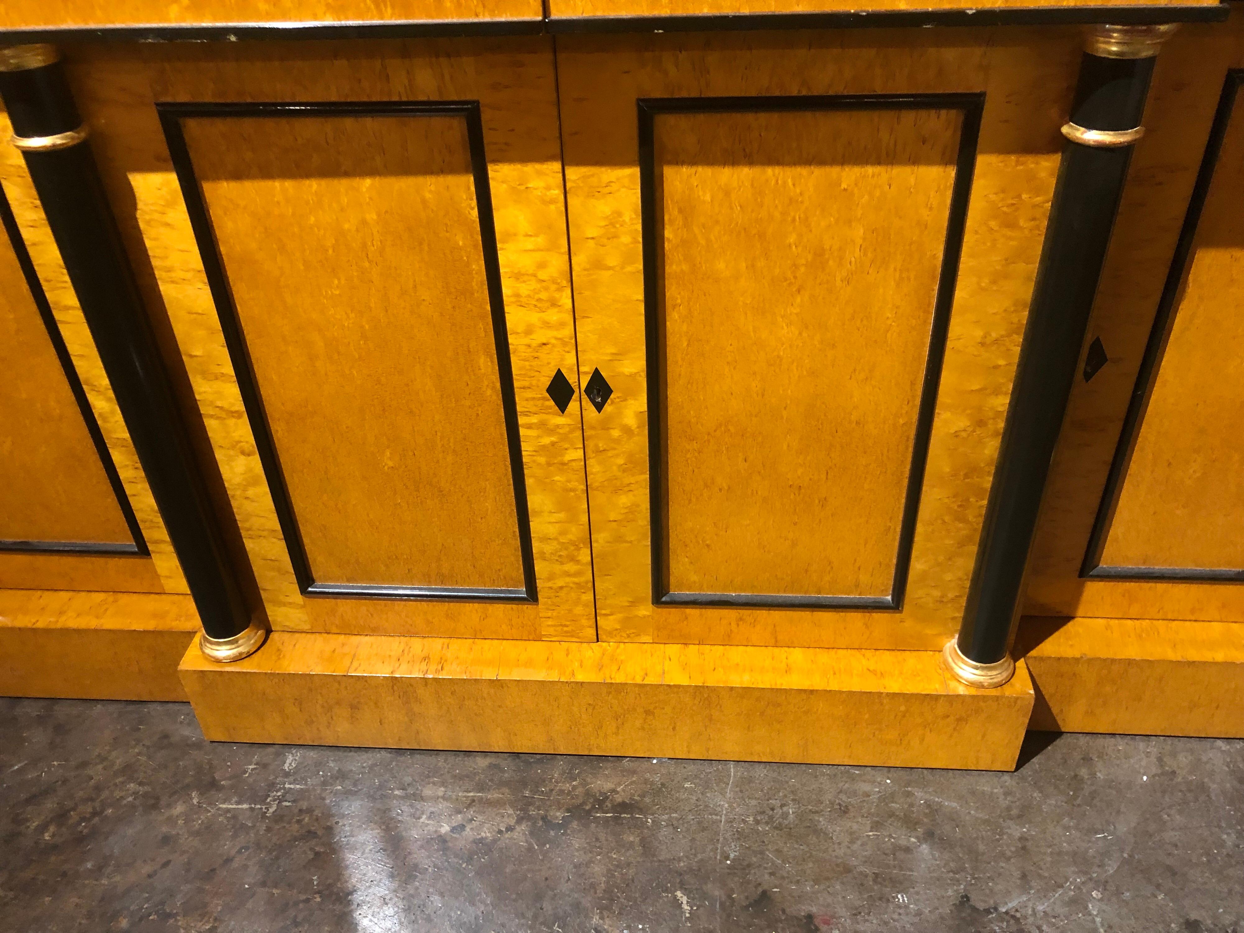 Very handsome Beidermeier style maple and ebony 4 door credenza. This piece has a lovely finish and ample storage and blends well with various different styles.