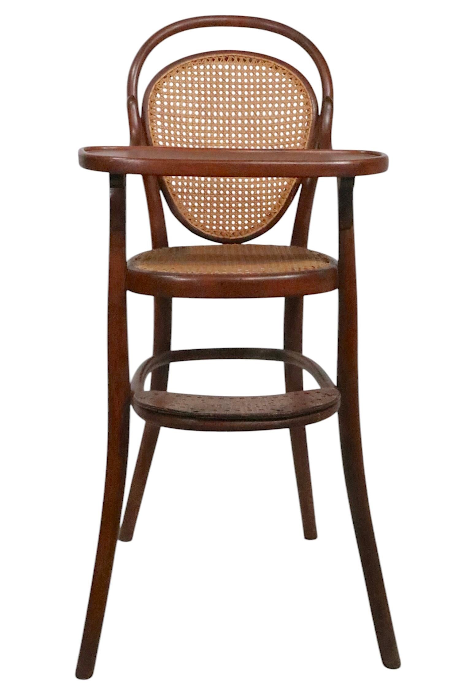 Exceptional antique highchair from the Vienna Secessionist movement, made in Austria late 19th - Early 20th century, attributed to Thonet, unsigned. The chair is in very good, clean, ready to use condition, showing minor wear etc, normal and