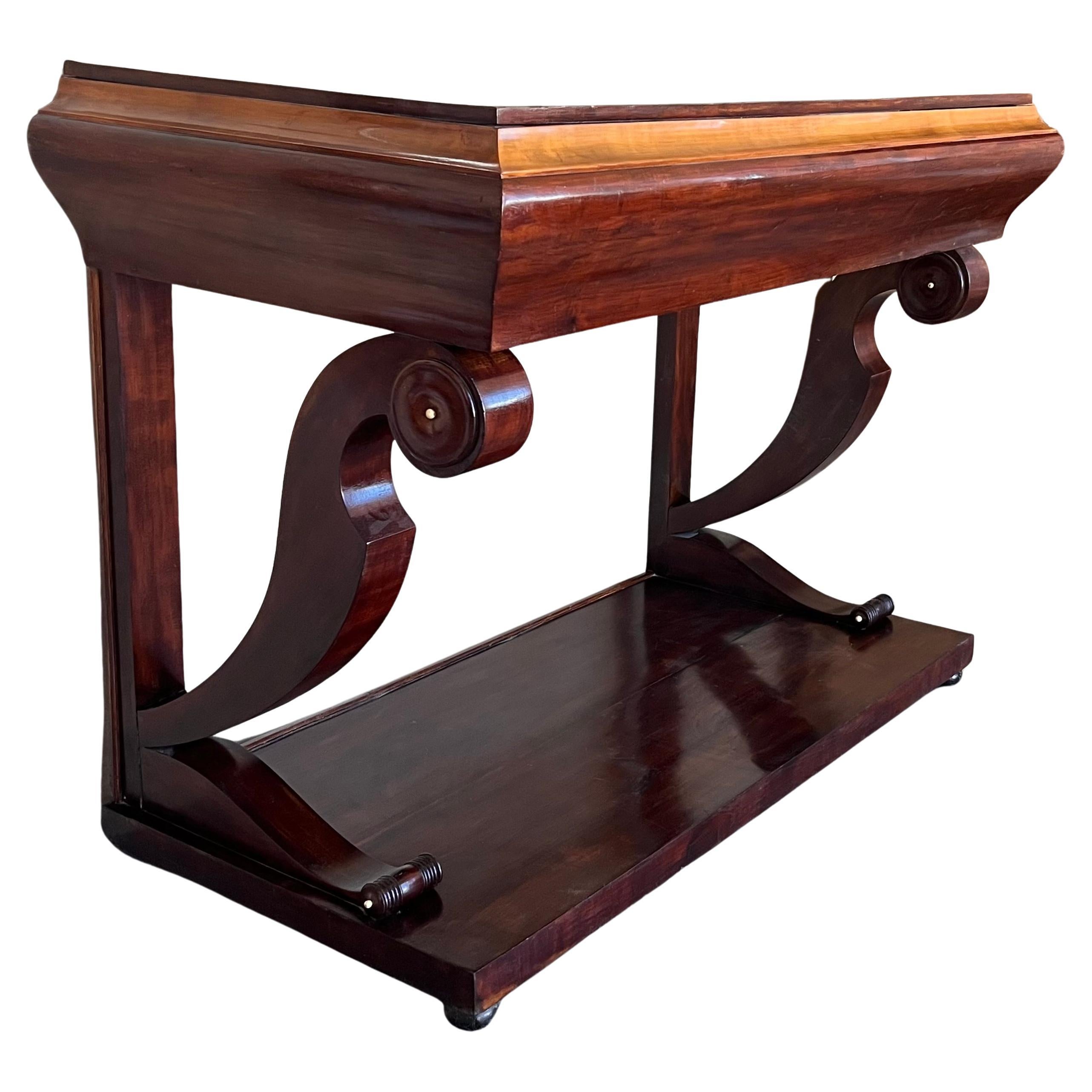 Absolute unique walnut wall console table artfully made in the early Biedermeier period circa 1830 in Austria. Made with mahogany veneer with its fantastic processed S-shaped legs. The amazing mirror-matched veneer work is highlighted by fine maple