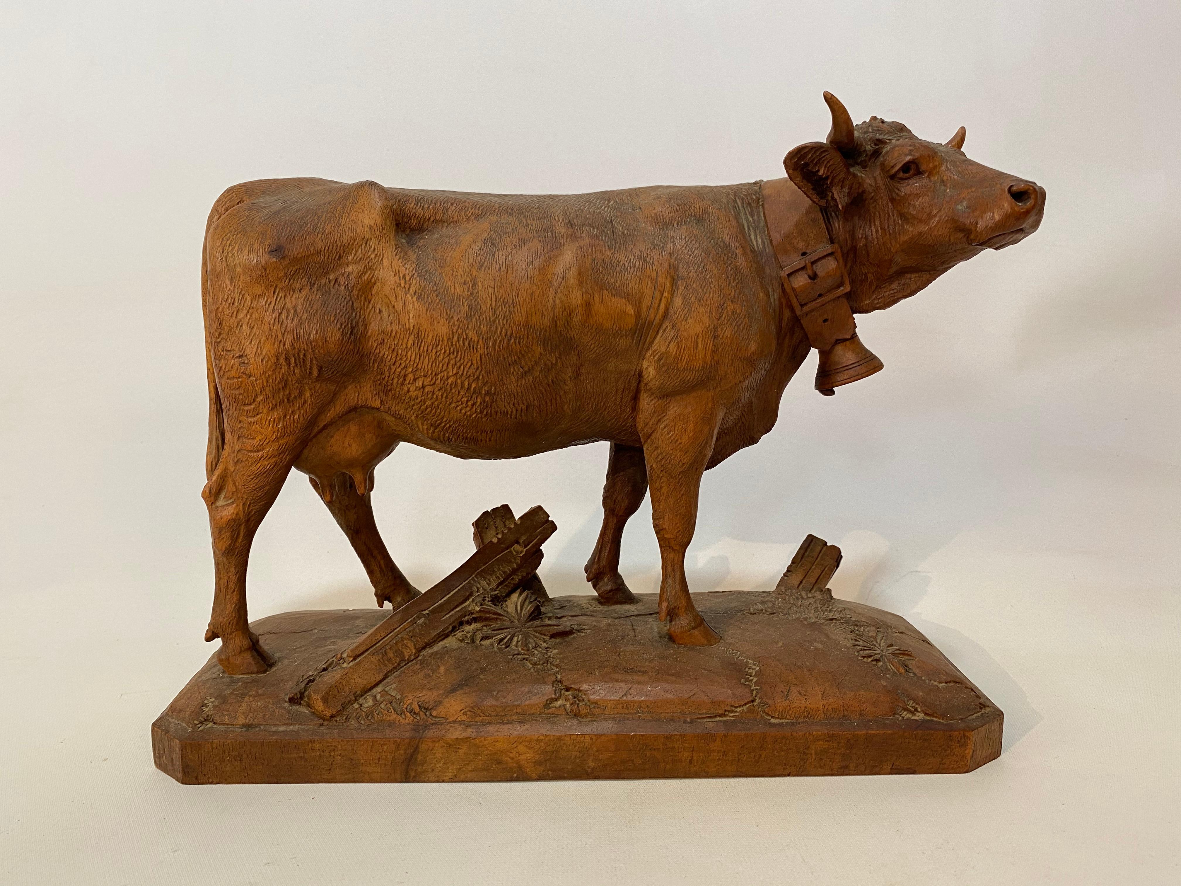 Exquisitely detailed Black Forest carved wood cow. A beautiful patina and tactile quality. Labor intensive attention to the structure, line of sinewy musculature and thickness of the coat. Exceptional carving from, most likely, the Black Forest