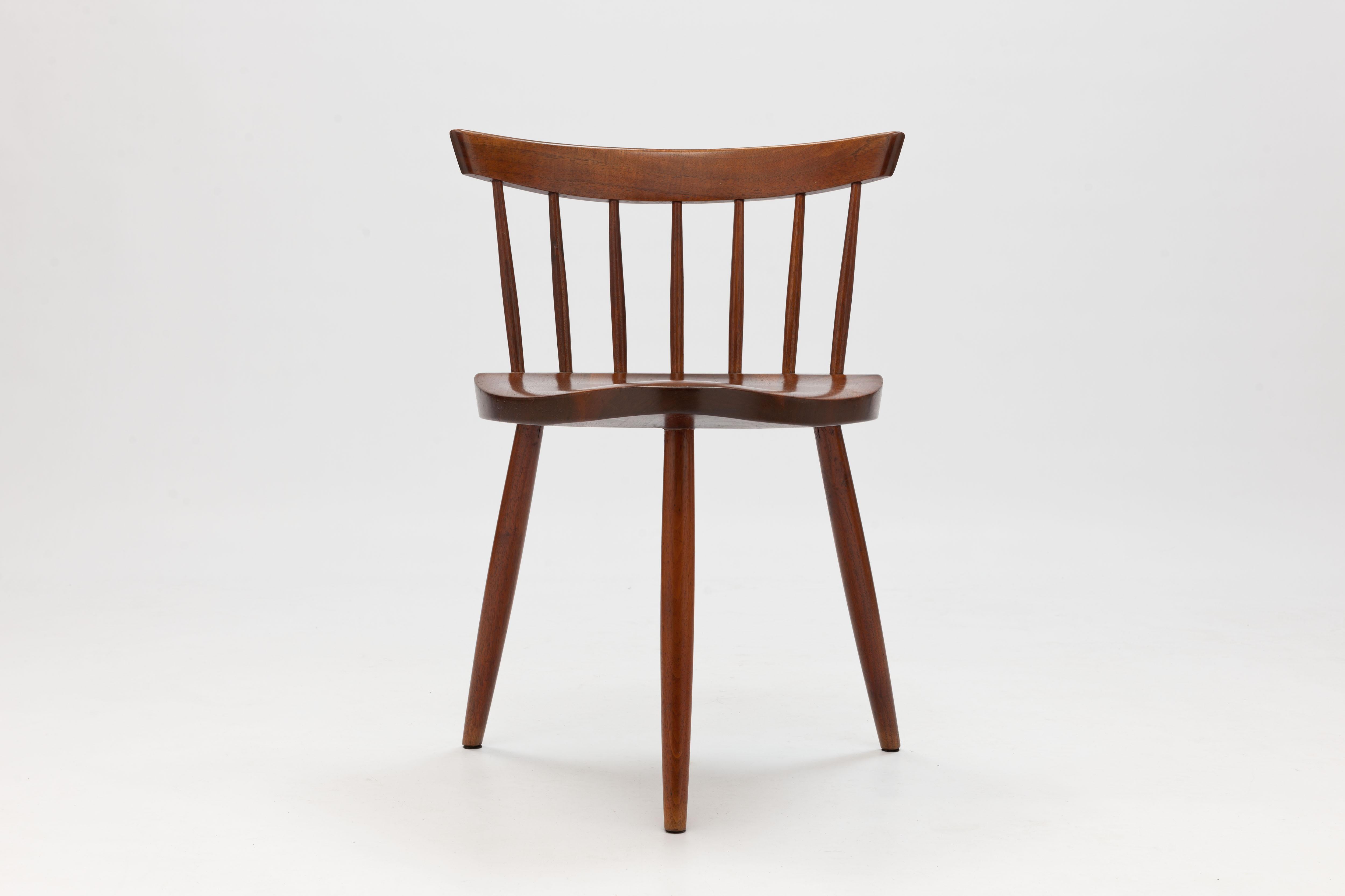 Named after his daughter, the Mira Chair was originally designed by George Nakashima - architect, designer and master cabinetmaker - around 1950.
The chair has a triangular seat which is supported by three turned legs. A variation on a