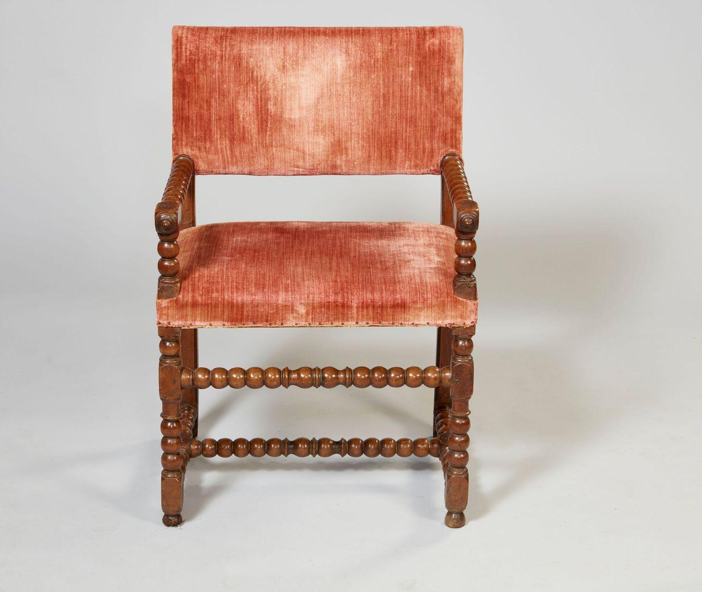 Late 17th century Italian walnut square back armchair with bobbin turned arms, legs and stretchers, the whole possessing good rich color and crisp turnings.