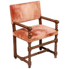 Sillón antiguo de madera de nogal torneada