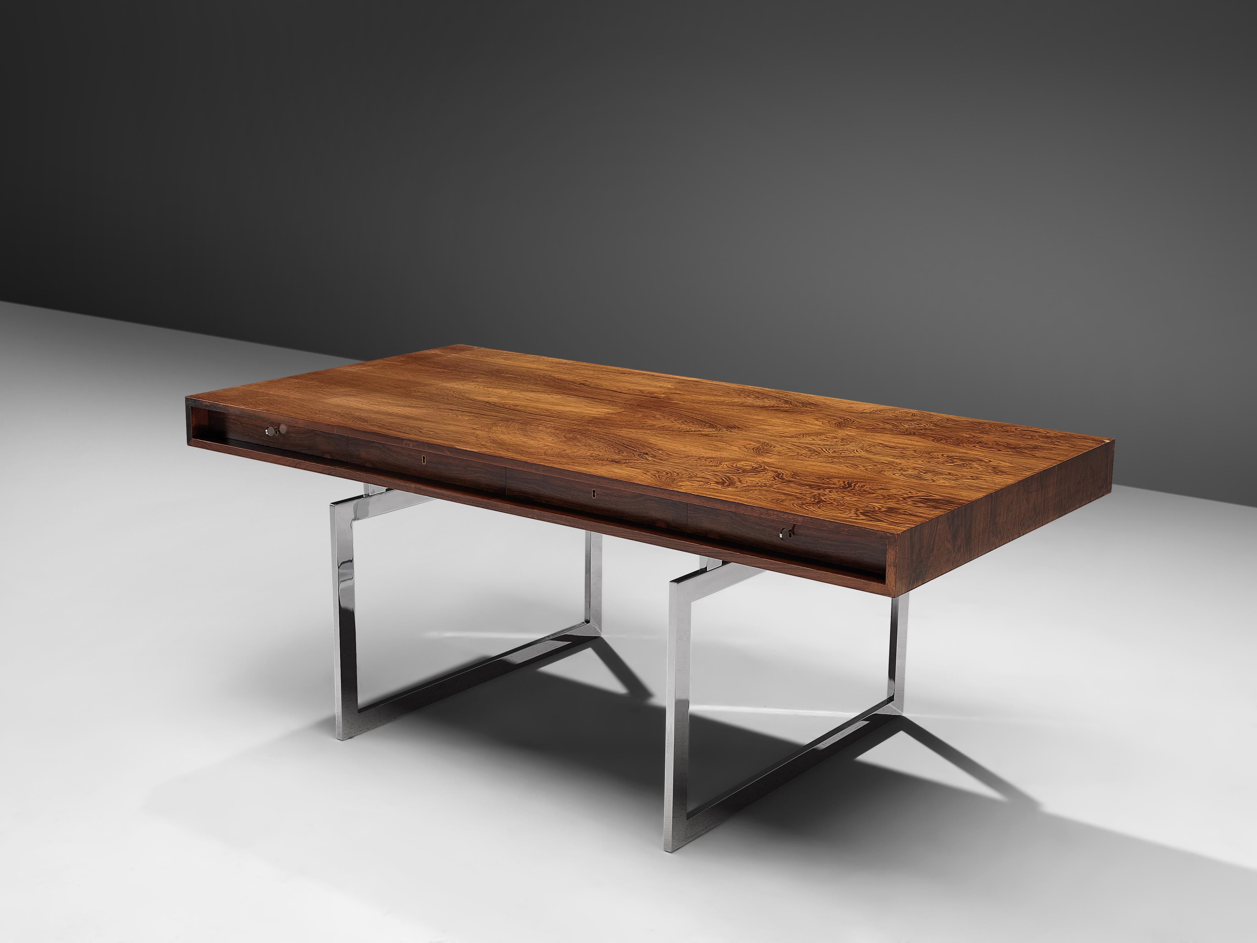 Bodil Kjaer for E. Pedersen & Søn, table model 901, Brasilian hardwood and chrome steel, Denmark, 1959.

This free-standing desk in rosewood is designed by the Danish designer Bodil Kjaer. The desk can be used with multiple purposes, as a writing