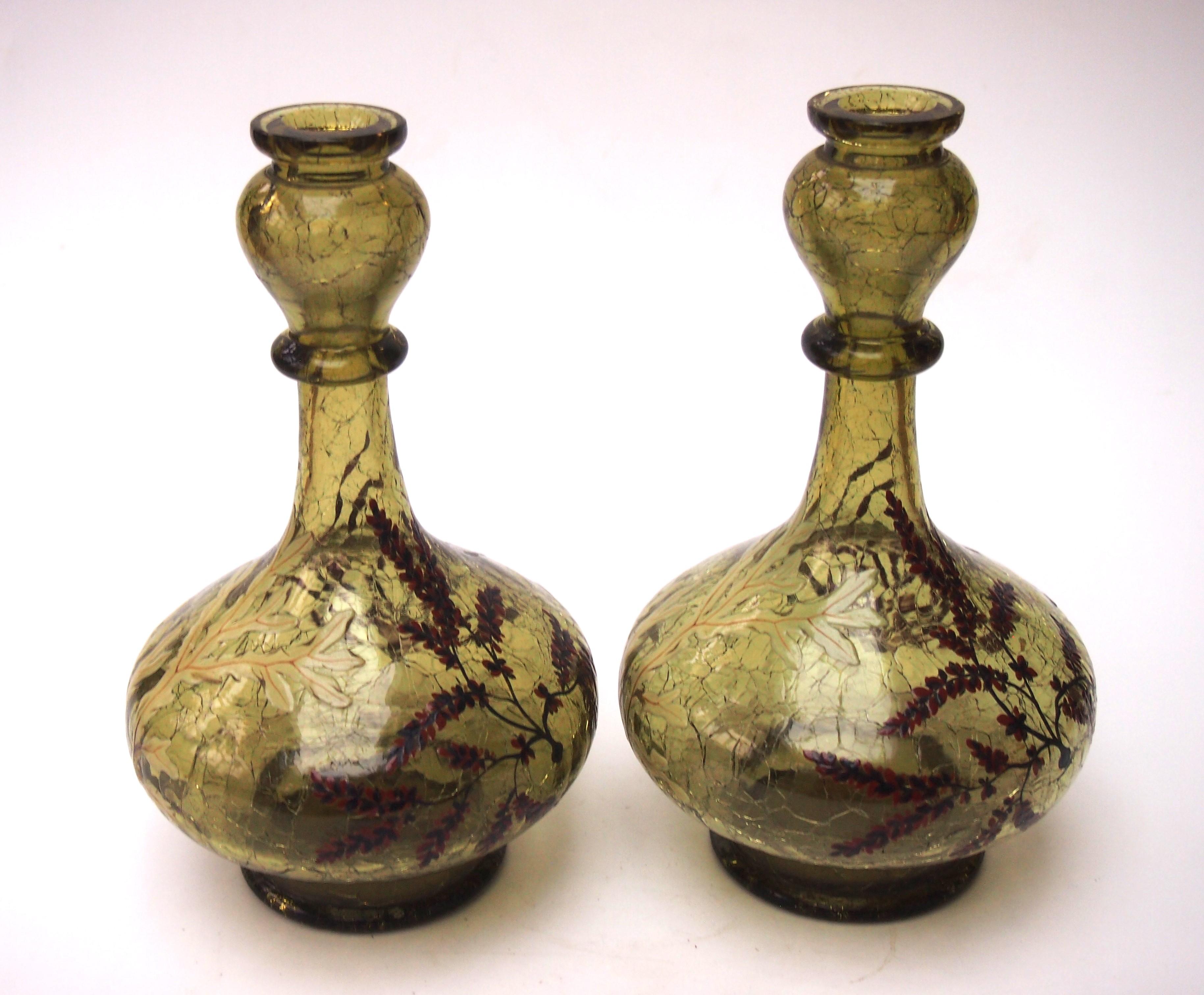 Iconic early Moser Crackle glass pair of vases in deep sea green colour heavily and finely enamelled with a classic aquatic scene including various types of seaweed mostly in purples and pale green. The vases are hand blown and have cold cut tops,