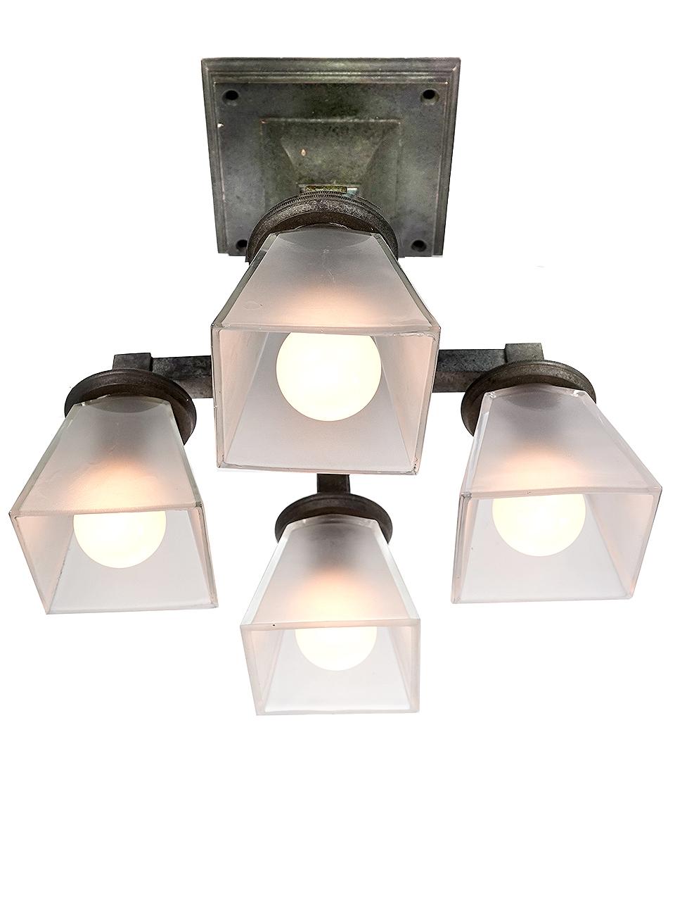 Machine Age Early Bronze Quad Subway Sconces For Sale