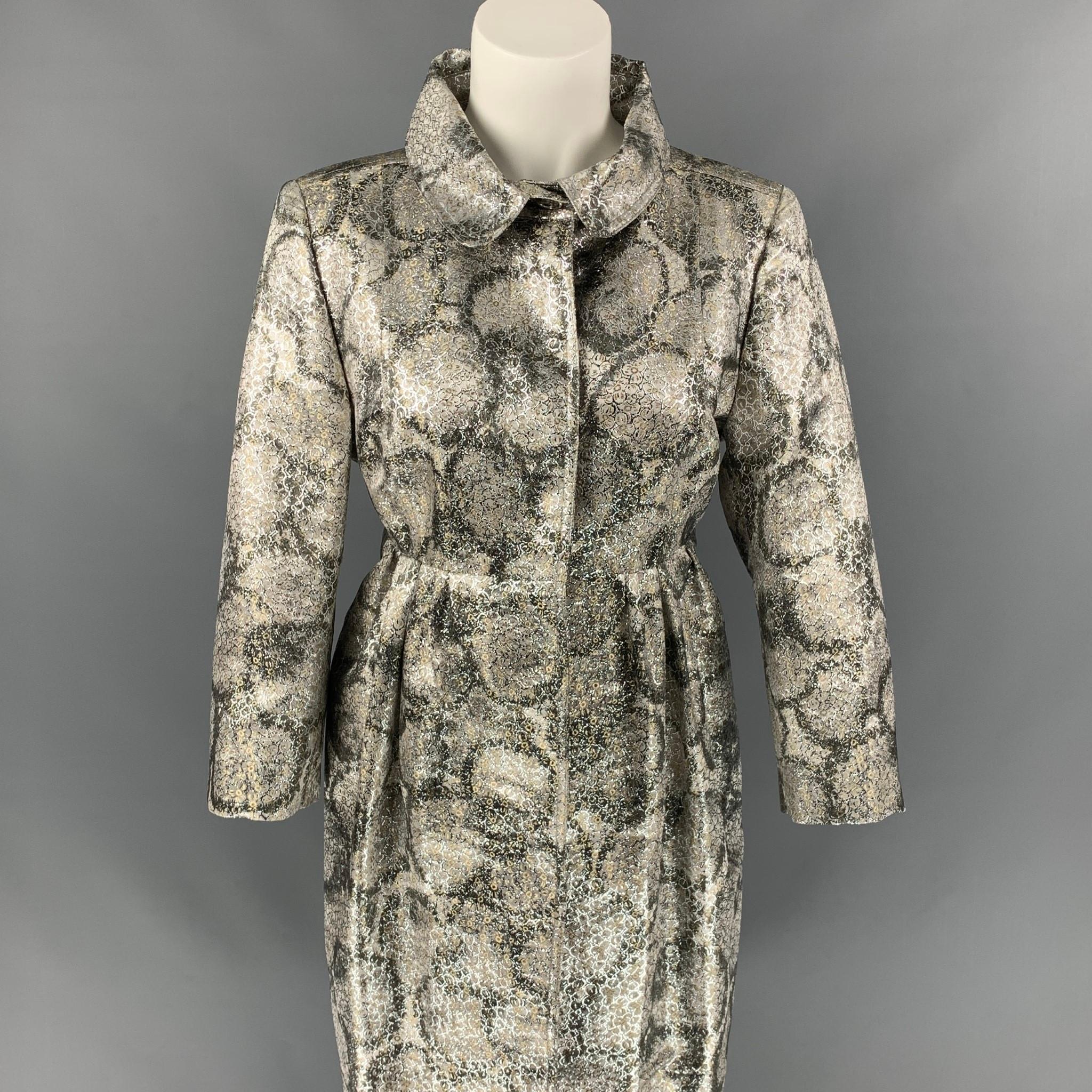 Early BURBERRY PRORSUM coat comes in a silver metallic jacquard silk blend with a full liner featuring an a-line silhouette, 3/4 sleeves, slit pockets, and a hidden snap button closure. Made in Italy. 

Very Good Pre-Owned Condition.
Marked: