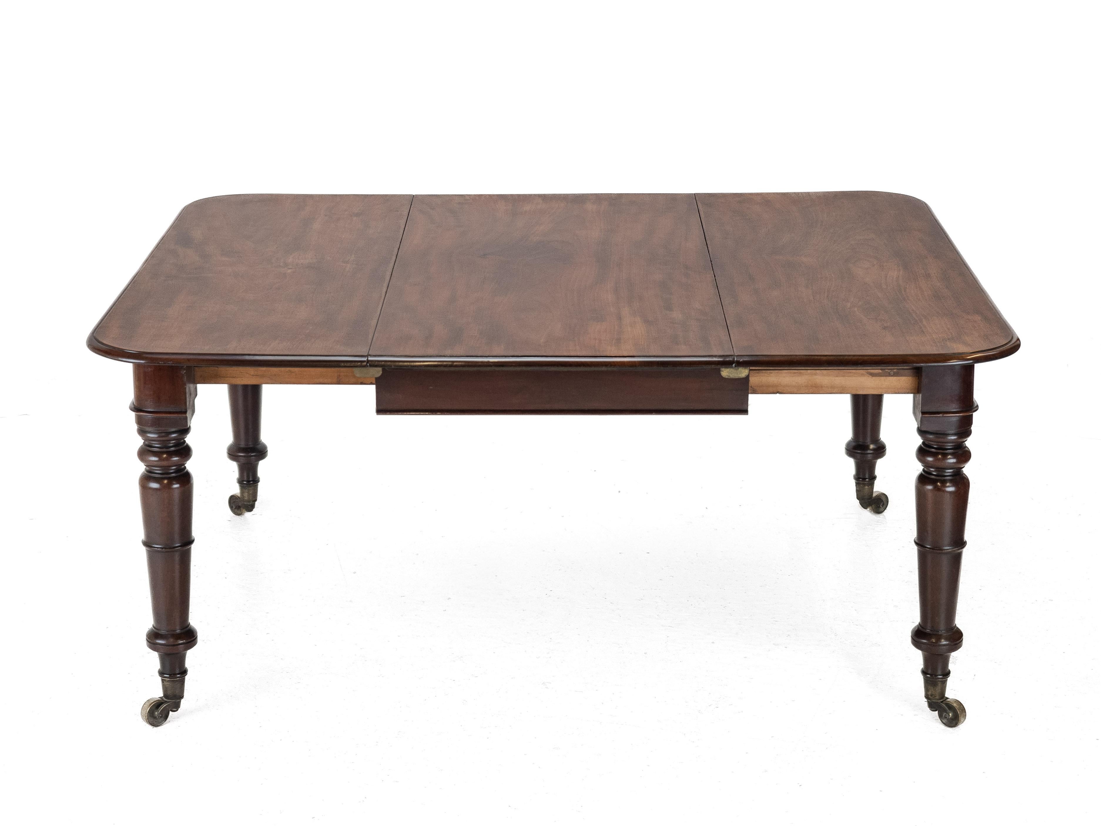Fine Regency Mahogany Extending Dining Table, Circa 1820

A fine early 19th century Regency period mahogany pull-out extending dining table of small and elegant proportions. Crafted from well-figured, high-quality solid mahogany, the oblong top has