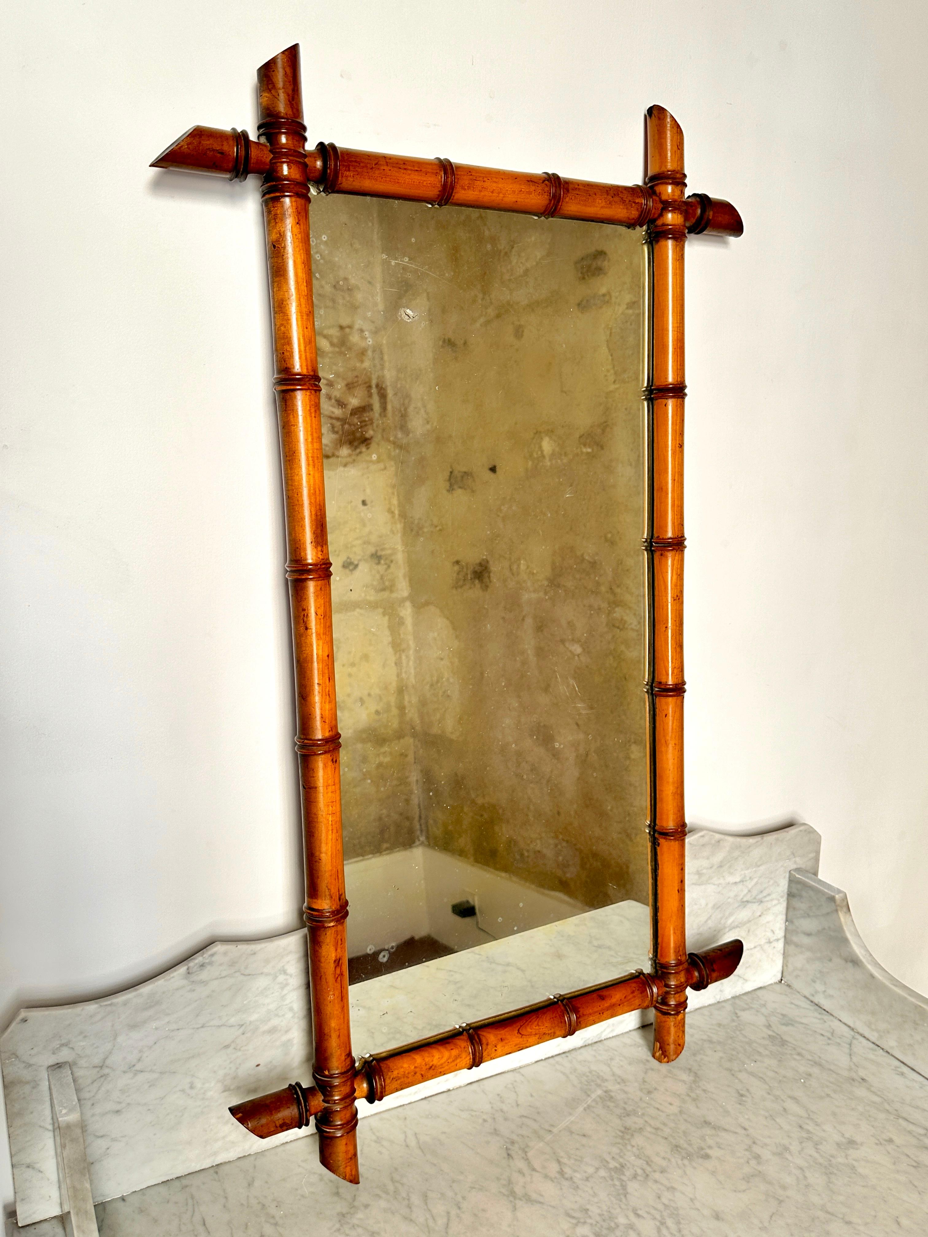 Early C20th faux bamboo mirror.

Wonderful French mirror with turned beech frame and original back. In very good, solid condition with some wear and chipped ends (see photos). Light and attractive foxing. Can be hung portrait or landscape.

87cm x