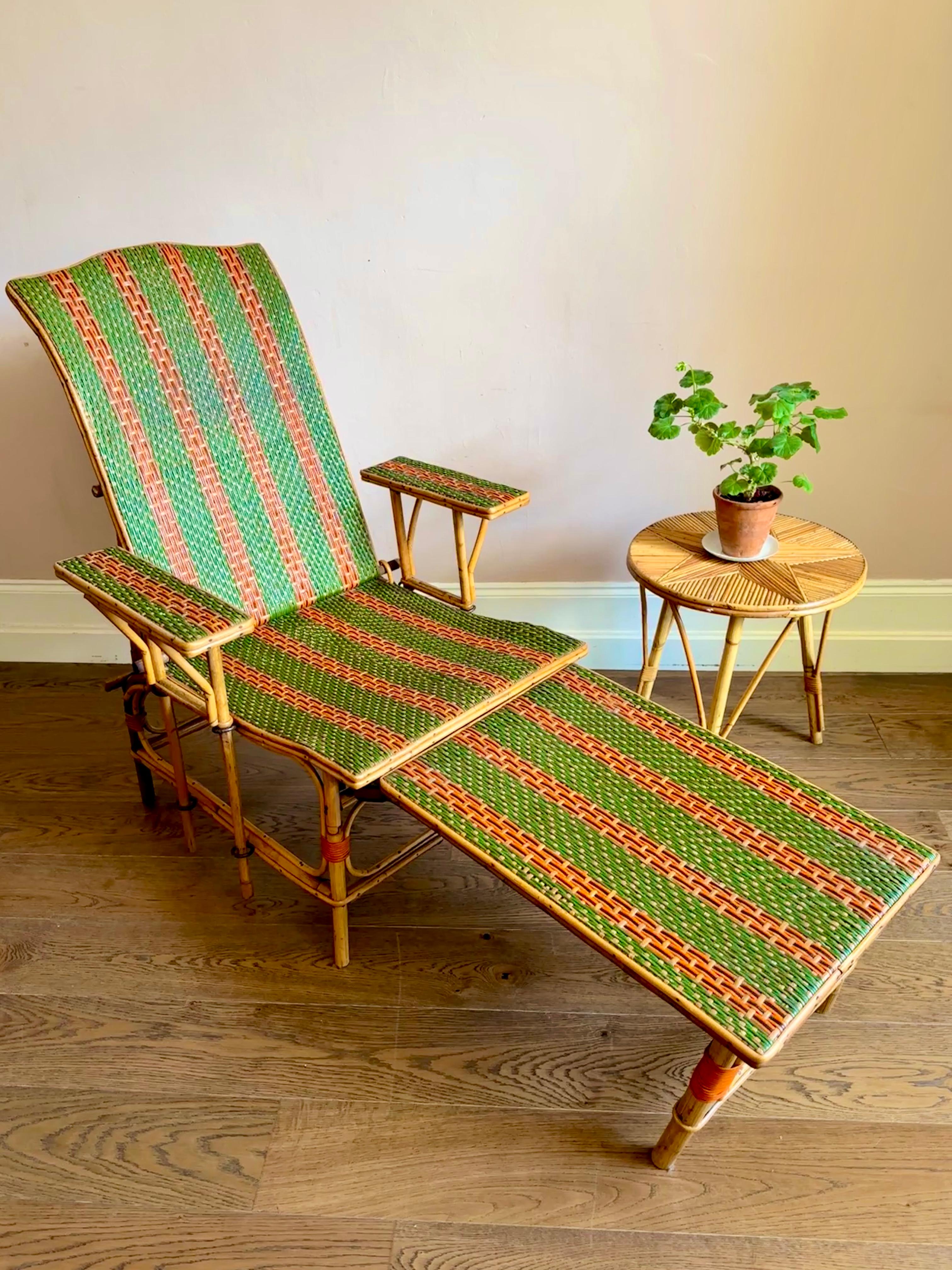 Early C20th French bamboo & rattan chaise longue.

Beautiful and unique adjustable sun lounger, circa 1920, with removable armrests and foot stool. In excellent and sturdy condition with some light wear consistent with age and use. The front right