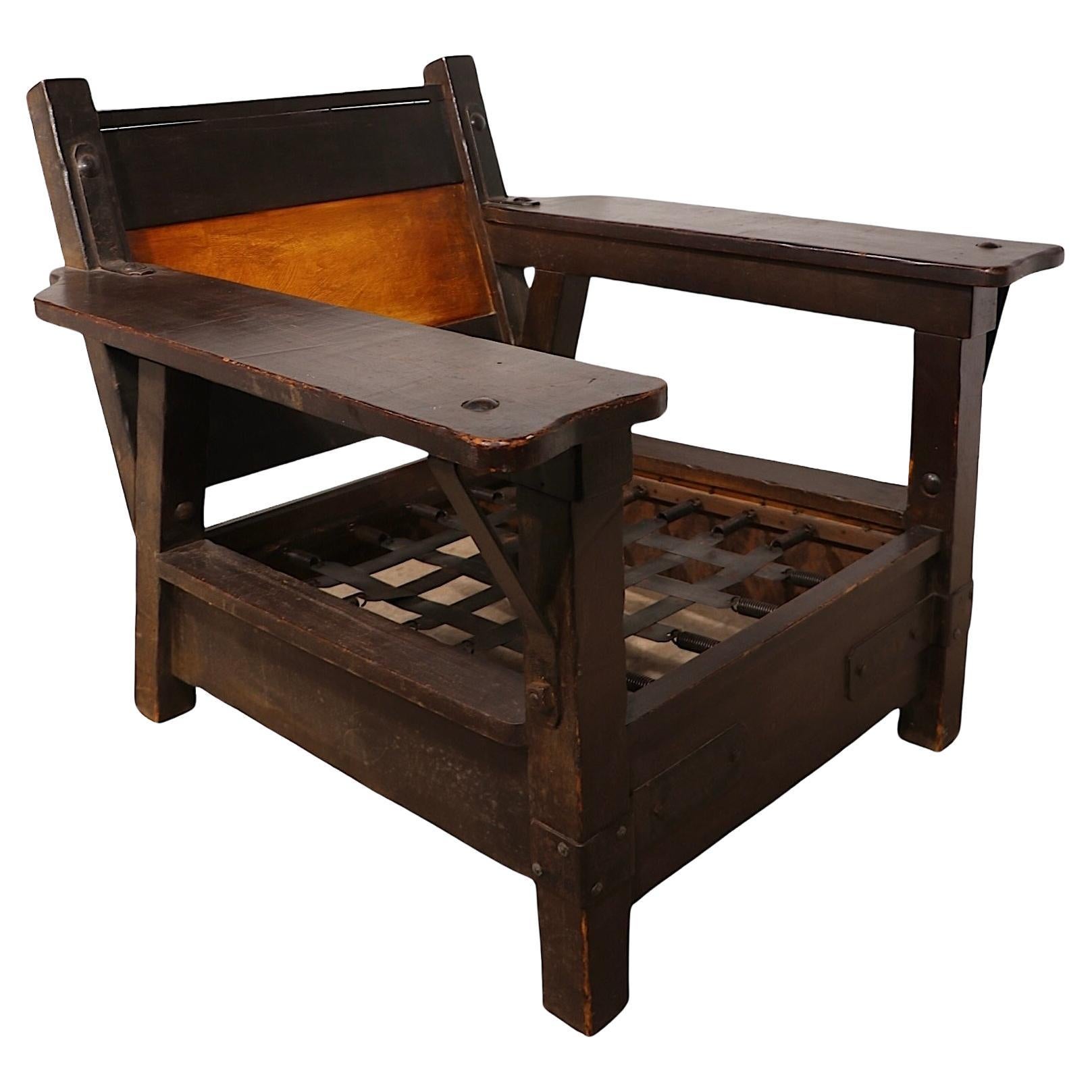 Incredible Monterey Furniture Club, Lounge Chair made in California circa 1930's. The chair features a thick chunky alder wood and iron frame with a signature hand painted panel on the back. Hard to find vintage Monterey pieces, this model is rare,