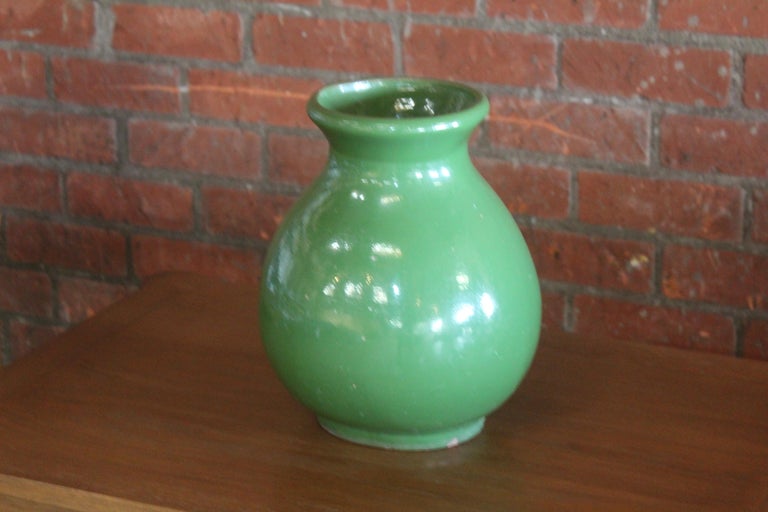 A vintage Californian terracotta vase in a wonderful green glaze- most likely from the 1920s-1930s. In overall great condition with a few small chips.