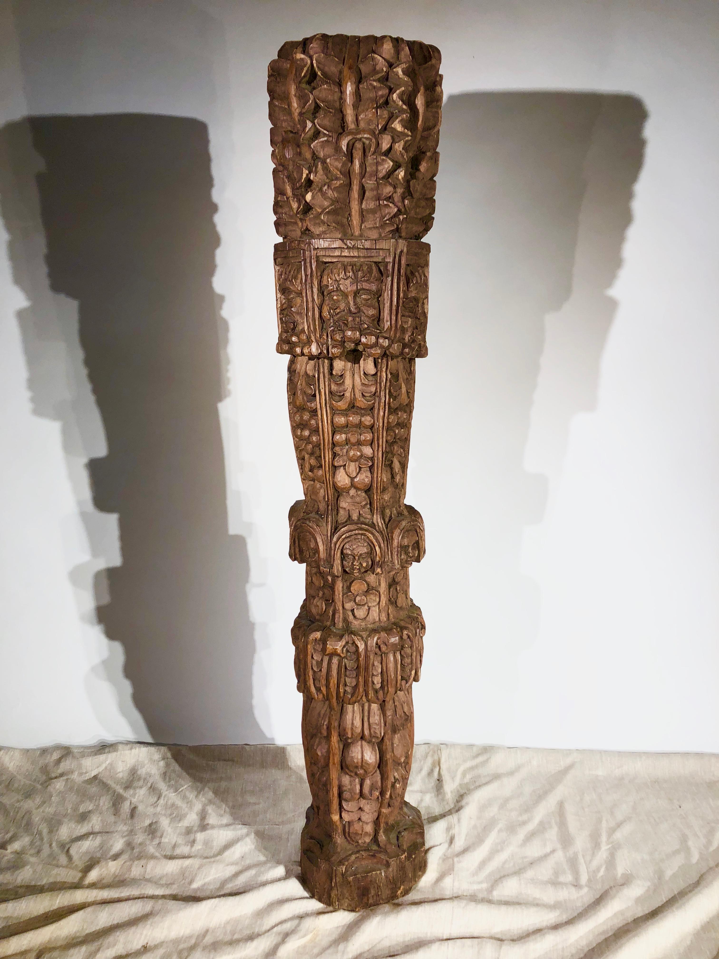 An elaborately carved architectural column in oak, possibly 18th century or earlier, English.
