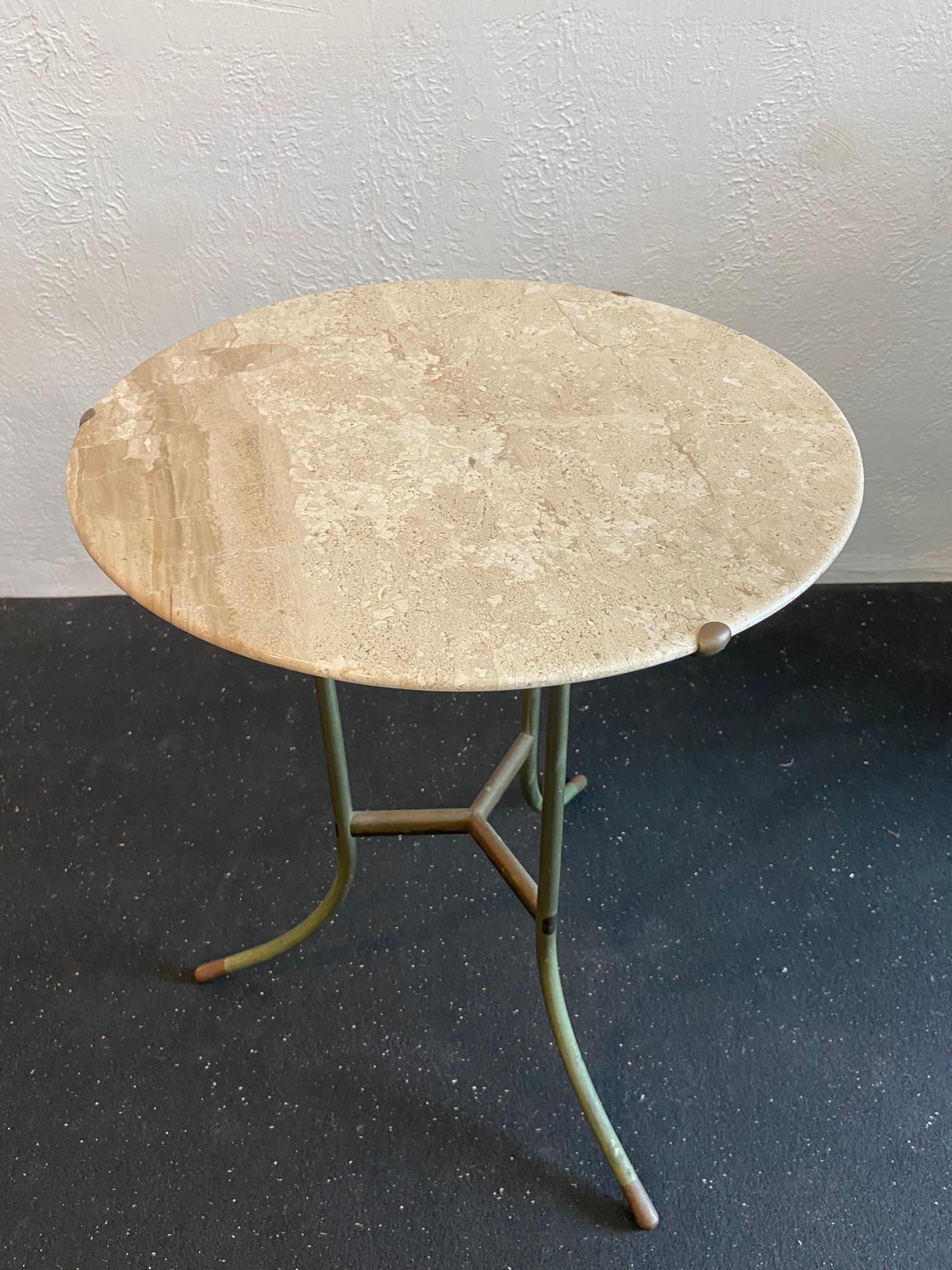 Early Cedric Hartman marble and mixed metal “AE” table. Signed. Beautiful original patina to the base, unpolished. Edges of marble top are free of any chips (please refer to photos). 

Would work well in a variety of interiors such as modern, mid