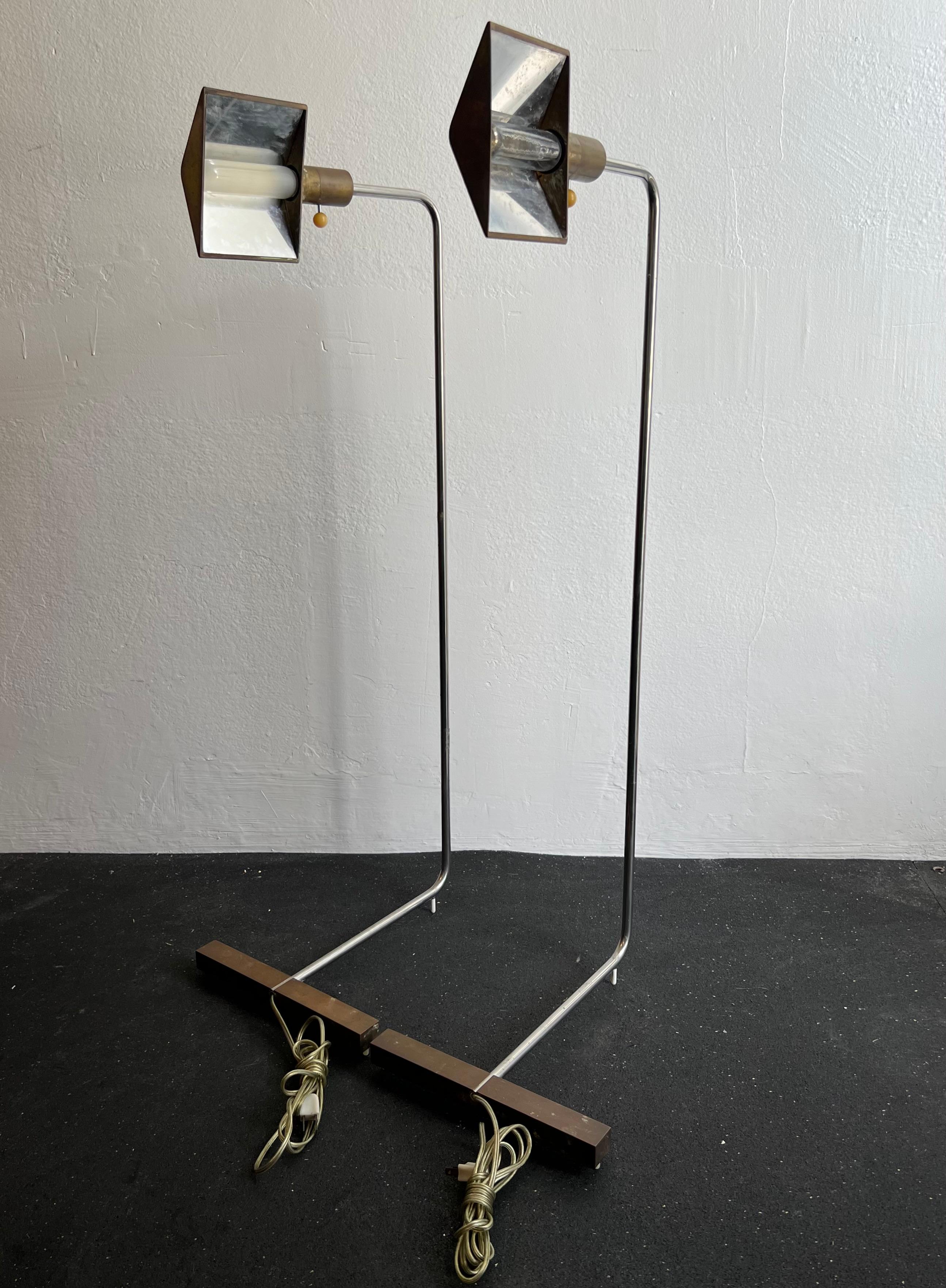 Pair of early 1MUWV Cedric Hartman floor lamps. No apparent markings. Brass and polished aluminum/chrome finishes. Patination throughout, unpolished (please refer to photos). Original wiring/hardware found in working condition. Additional photos