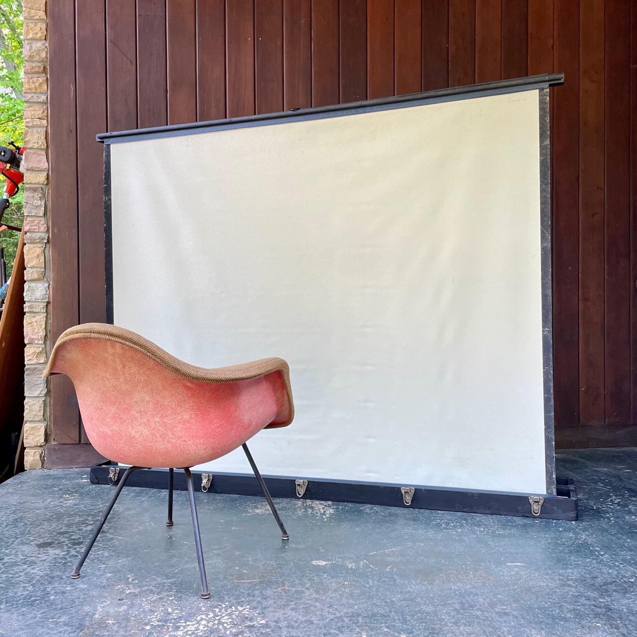 Very large roll-up movie screen in a box.

Overall W 75 x D 12.5 x H 57.5 in.
Screen W 68 x H 53 in.