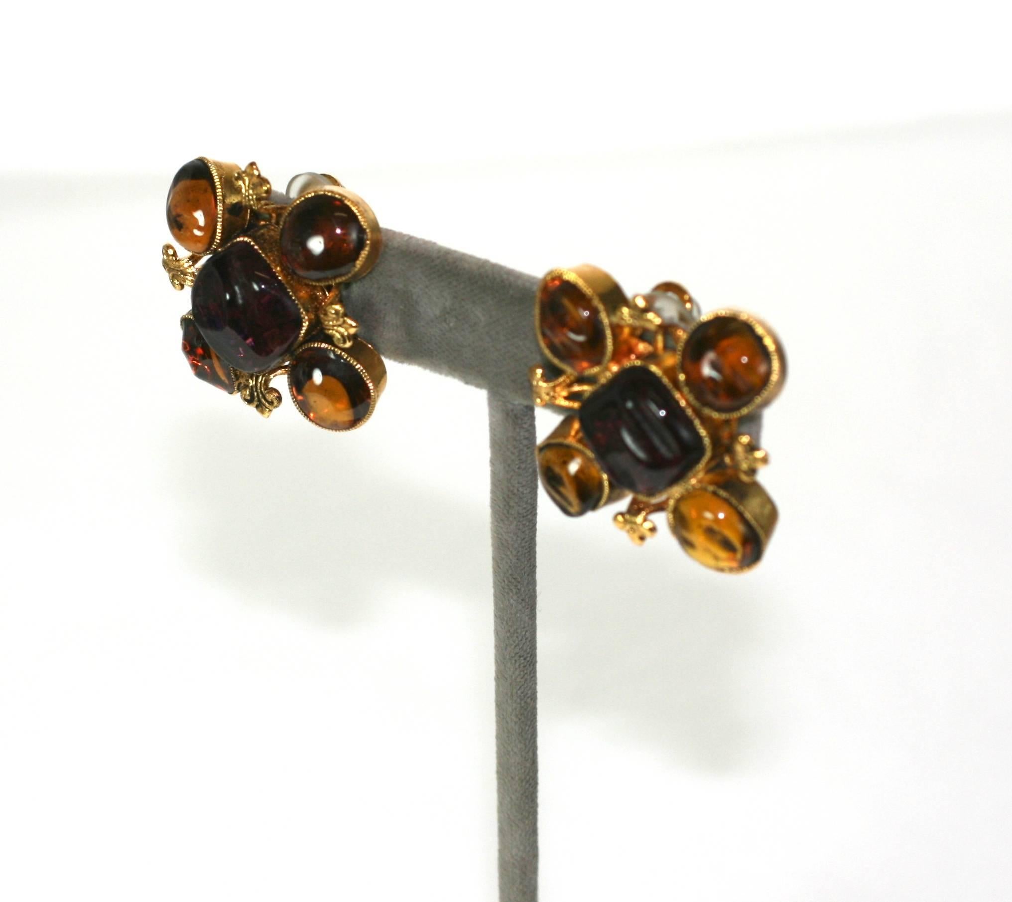Early Chanel classic gilt byzantine ear clips  of amythest and topaz poured glass enamel by Maison Gripoix.  Handmade. Signed Chanel. Clip back fittings. 
Excellent Condition, 1960's France. 
 L 1.50