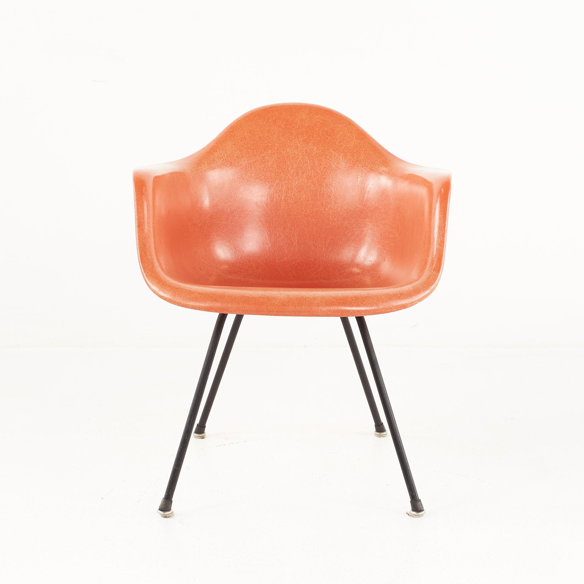 Early Charles and Ray Eames for Herman Miller Mid Century Orange Fiberglass Shell Arm Chair

This chair measures: 24.75 wide x 20 deep x 27.5 inches high, with a seat height of 15.75 and arm height of 23.5 inches

All pieces of furniture can be