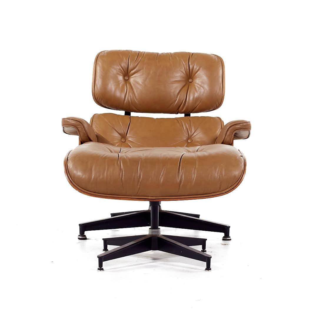 Charles and Ray Eames For Herman Miller Mid Century Rosewood Lounge Chair and Ottoman

This chair measures: 33 wide x 34 deep x 32 inches high, with a seat height of 16 and arm height/chair clearance of 20.25 inches
The ottoman measures: 26 wide x