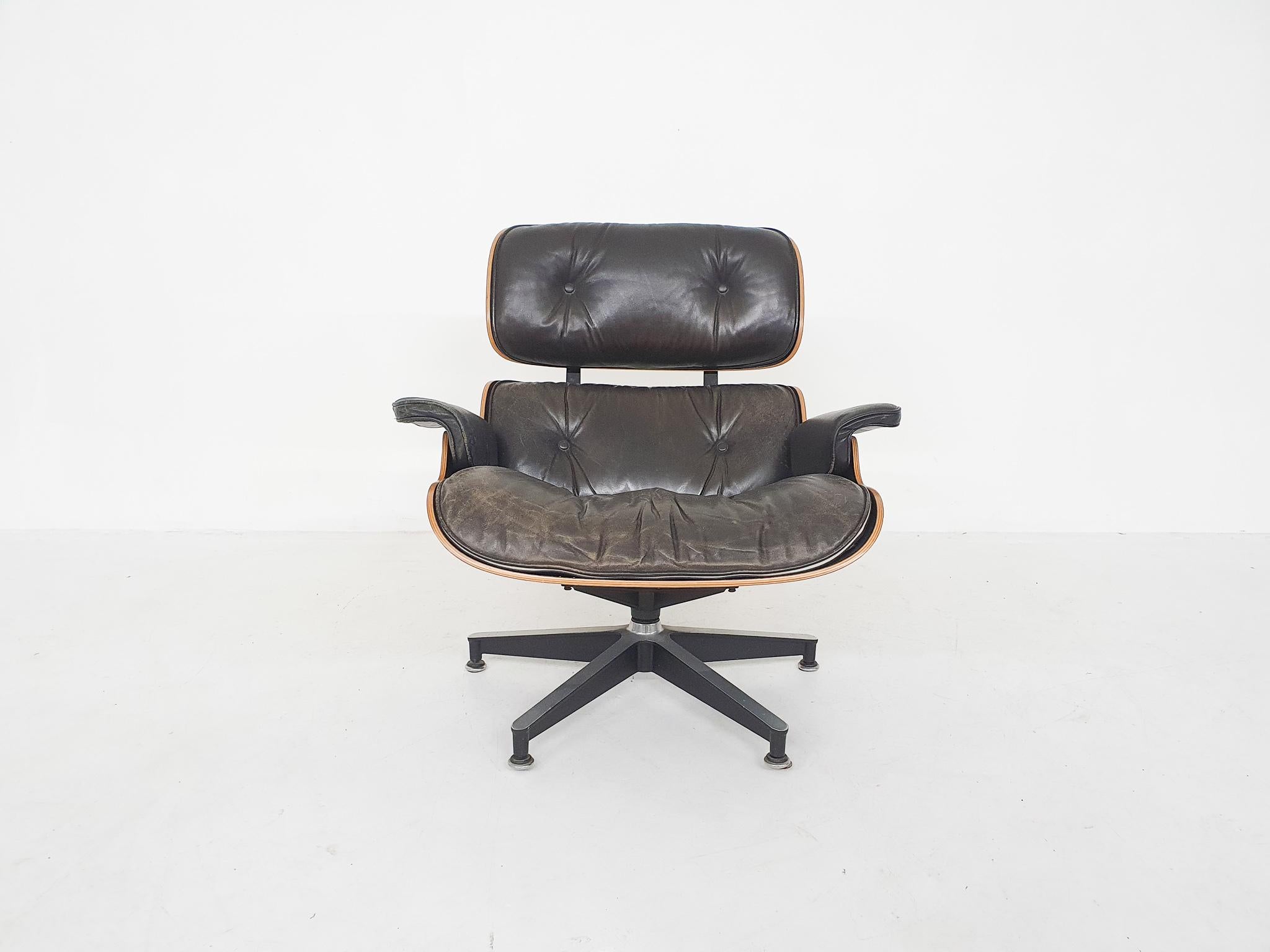 The famous lounge chair by Charles and Ray Eames for Herman Miller. The chairs has black leather cushions and a black painted rosewood shell.

This chair is a marked original and quite a rare example from the 3rd generation. The 3rd generation was